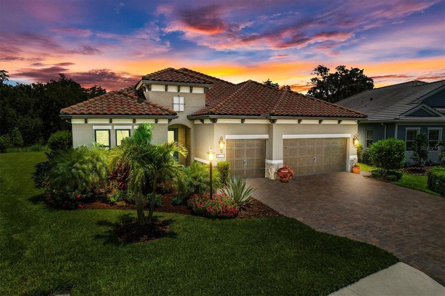 INDIGO / Lakewood Ranch...A much sought after, gated and maintenance-free community offering an Amenity Center with a Clubhouse, Pool, Spa, 24/7 Fitness Center, Pickleball courts, Bocce ball, and a Playground. The full-time Activity Director manages an extensive calendar of activities and services for the residents all for a low HOA fee!! Welcome to this Tuscan, Silver Sky II Model that comes with 4 bedrooms, 3 full baths, a dedicated den/study and has been maintained with great detail. Built to include $94,000 in builder upgrades and over $140,000 in post construction owner select options. A stately vestibule boasting gorgeous porcelain tile sets the stage upon entering this most impressive home! The open floor plan is accented with ten foot high ceilings and disappearing pocket sliders that draws one to take in the most stunning tranquil preserve views around! Amble out to the Lanai and appreciate a full house width Travertine deck, heated saltwater pool including waterfall, bench seating, multi color LED lighting, Pentair smart POOL home equipment Plus automatic pool vacuum. There is also an integrated and raised spa/hot tub, 50” mounted Toshiba TV and a panoramic vista view screen enclosure accenting nature's beauty. The great room & dining room are accented with features like coffered ceiling/ceiling beams, crown and chair moldings, custom millwork, wainscoting trim in the dining room. Your gourmet kitchen has a substantial sized walk-in pantry with a glass door & custom designed shelving, GE Profile series Stainless steel suite of appliances including wall ovens, cooktop, upgraded cabinetry with pull outs shelves, pots & pans drawers, elegant basket weave backsplash over quartz and an oversized sink. NATURAL GAS is used for the cooktop, dryer, pool heater, hot water tank and lanai stubbed for a grill. The master bedroom has wonderful views of the preserve through thermal tinted windows, two walk-in custom designed closets, master bath with 2 vanities, water closet, large shower with transom window. The guest En-suite is located on the opposite end of the home with a private bath and walk-in closet. You won't believe the enormous laundry/utility room and how functional it is! UPGRADES INCLUDE * Impact glass windows & sliders * All interior, exterior and closet doors are 8' tall * 19 Real WOOD Plantation Shutters * Designer light fixtures & 7 lighted ceiling fans * Automatic light switches in the pantry, garage & laundry PLUS low voltage landscape lighting around the pool * Security system plus 4 cameras/audio/recorder * Full, whole house wrap around gutters with underground downspouts * 3 Car garage with Rust-Oleum rock solid Polycuramine Coating, overhead storage racks, a wash tub, Whole house Pentair water filtration and softener system with reverse osmosis filtration in kitchen * Paver walkways to pool equipment and hose bibbs added * Acrylic sealed paver driveway and walk-way to front door. This home is so well built and constructed to the most current and stringent building code that the owner's property insurance annual cost is $1541 or $129 per month. $1,185,000