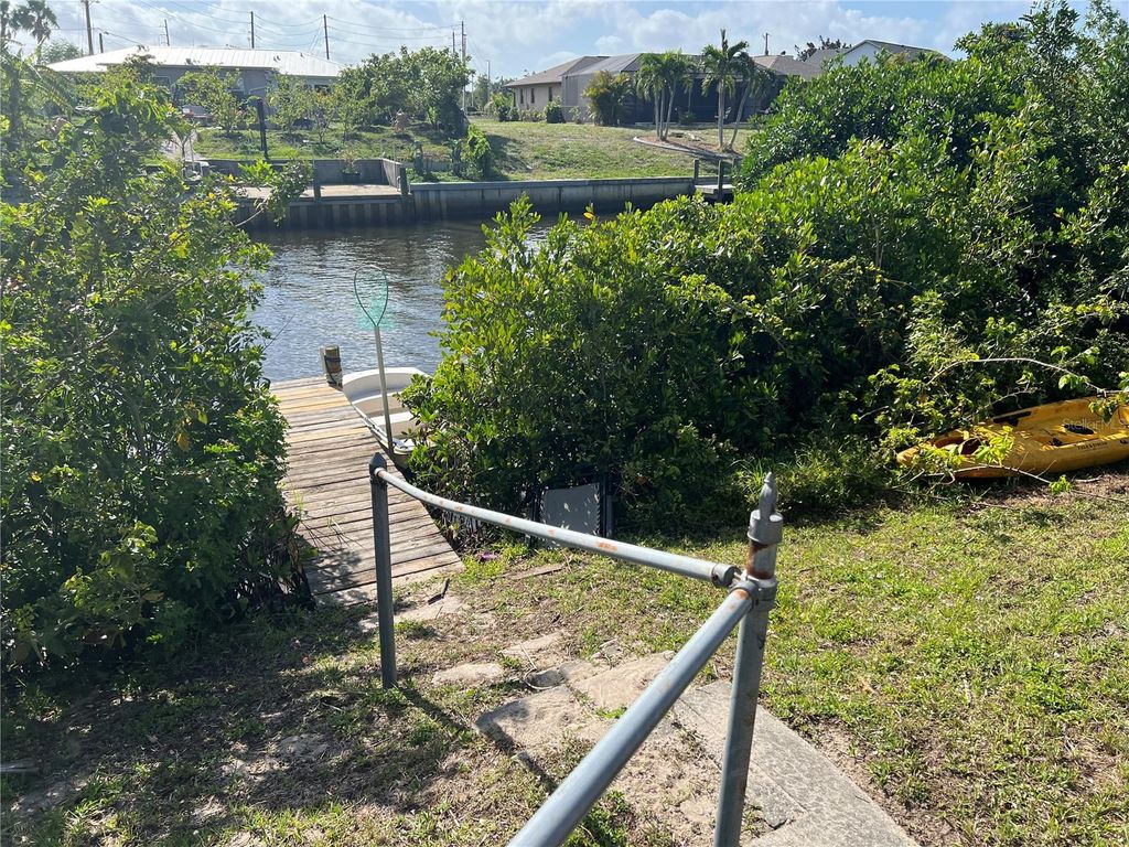 Photo of 705 Crestview Circle NW, Port Charlotte, FL 33948 (MLS # C7514553)