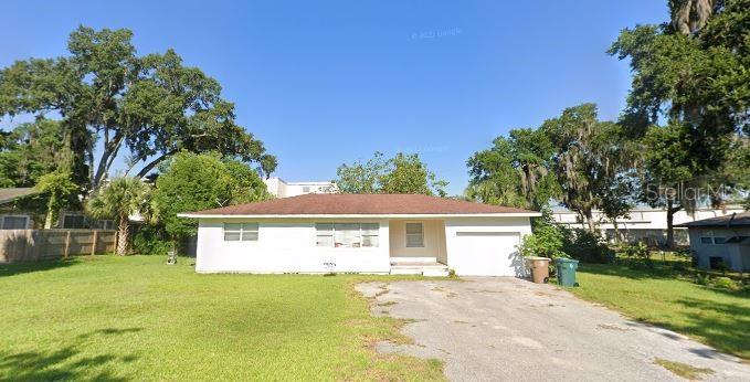Charming 3-bedroom, 1-bath home with a 1-car garage on a spacious 0.4-acre lot. Enjoy a large, fenced backyard with lush landscaping for added privacy. Inside, you’ll find hardwood floors, wood paneling, ceiling fans, and an open kitchen with plenty of room to cook. The primary bedroom offers two deep closets, while the laundry room features hookups and exceptional pantry storage. Conveniently located within walking distance of the Ocala Public Library, Veterans Memorial Park, restaurants, and shops, and just one mile from downtown Ocala. Adjacent to an 18-hole golf course for added recreation. More photos to come, call and schedule a showing today!