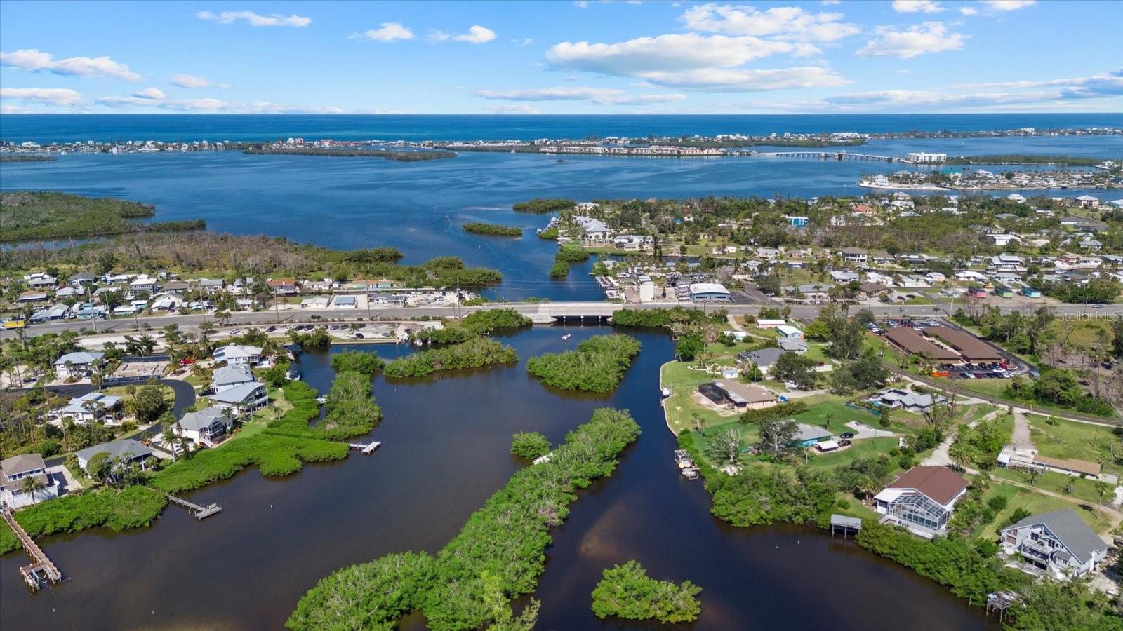 Waterfront Paradise with Direct Gulf Access – 1018 Lee St, Englewood, FL 34224 Discover the perfect blend of coastal charm and peace of mind in this beautifully elevated waterfront home, nestled on a serene canal with a bridge to go under to the Gulf. Not Sail boat water. Located in a quiet, well-kept neighborhood, this 3-bedroom, 2-bath gem is a boater's dream, complete with a private dock, davits, water and electric hookups – just minutes from open waters. Set high and dry, this home has proudly weathered Florida’s fiercest storms without flooding, offering you security and confidence in every season. Inside, enjoy a light-filled and thoughtfully updated interior, a generator which is a big plus for run the house incase of any power outage.