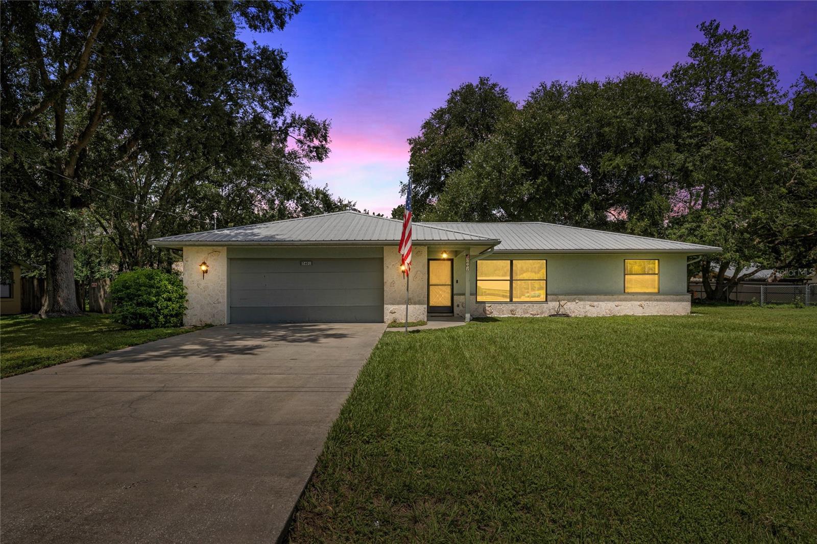 Discover this beautifully updated 3-bedroom, 2-bathroom home in a prime Southeast Ocala location! Step inside to find brand new luxury vinyl plank flooring, a freshly painted interior, and a spacious living room perfect for entertaining or relaxing. The kitchen is equipped with gas appliances and opens seamlessly to the dining area. The primary suite offers comfort and convenience with a walk-in closet and private bath, while two generously sized secondary bedrooms provide plenty of space for family or guests. Enjoy Florida living year-round on the screened lanai overlooking the shaded backyard—ideal for pets, play, or outdoor gatherings. Additional highlights include a metal roof for durability and peace of mind, plus an inside laundry room for everyday convenience. Move-in ready and set in one of Ocala’s most convenient locations, this home is a must-see!