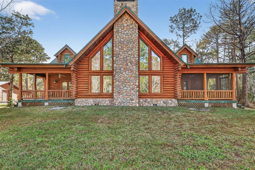 Set on almost 10 peaceful acres, this beautiful log cabin offers privacy, charm, and endless potential. Enjoy your private pond views from two front porches—perfect for relaxing and taking in the natural surroundings. Inside, soaring ceilings and a wood-burning fireplace create a warm, inviting atmosphere.
An unfinished upstairs bedroom provides excellent potential for a third bedroom or flexible living space.
Adding incredible value is a large detached workshop with both inside and outdoor space.  It features a bathroom, kitchen, and living area. After some restoration this would be ideal for a guest suite, studio, home business, or multi-use space.
If you’re looking for acreage, privacy, and a property with character and room to grow, this log cabin is a rare opportunity to create something truly special.