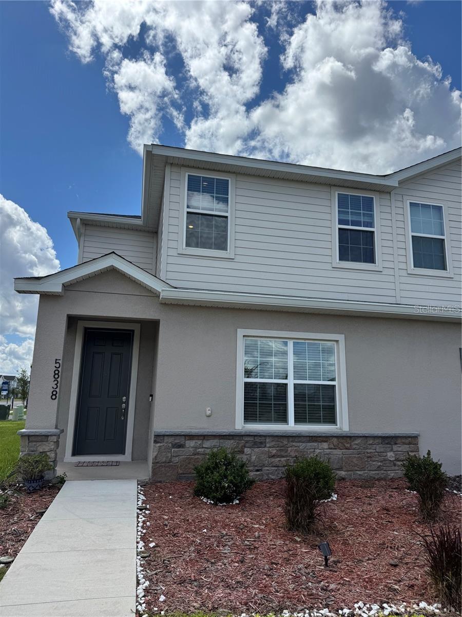 Welcome to this stunning townhome in St. Cloud's coveted The Crossings community! Situated on a desirable corner lot, this two-story residence offers a wonderful combination of comfort and style. With three bedrooms, two and a half bathrooms, and a two-car garage, it spans a generous 1,705 square feet.
Its open-concept design is highlighted by a gourmet kitchen featuring quartz countertops, Shaker-style cabinetry, stainless steel Samsung appliances, and a convenient walk-in pantry. The common areas feature luxurious vinyl plank flooring, while the bedrooms are outfitted with plush carpeting that adds a touch of comfort.
The spacious master suite is a true retreat, with a double vanity and tiled shower inviting relaxation. Plus, you'll enjoy a versatile loft that can be used as an office or gym. Window shades installed throughout the home, along with a washer and dryer, and energy-efficient windows, ensure comfort and efficiency.
This community also offers incredible amenities such as a swimming pool, a large shaded playground, a soccer field, pickleball courts, a fantastic picnic area, scenic trails, and wide walkways for outdoor enjoyment. All of this, just 15 minutes from Lake Nona and close to shopping, restaurants, schools, and hospitals, makes this property an ideal location for modern living.
Don't miss the opportunity to experience everything this home . Schedule your visit today in our welcoming neighborhood! We look forward to seeing you!