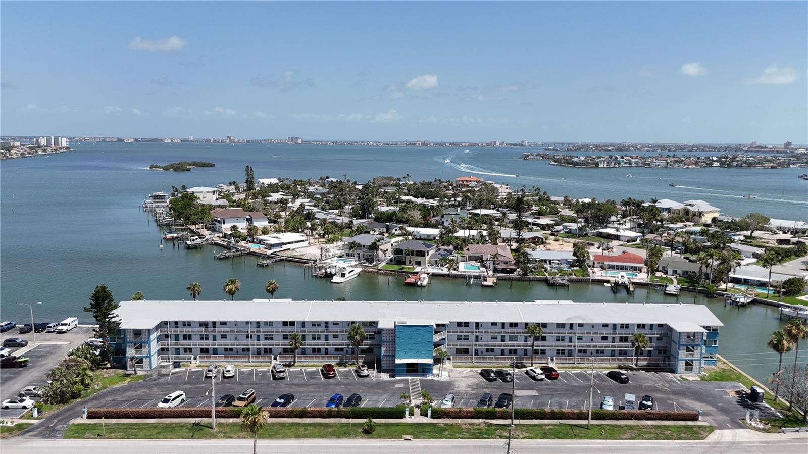 ***Motivated Seller*** Welcome to your own slice of coastal paradise in Shore Plaza, a peaceful 55+ waterfront community in South Pasadena. This beautifully maintained condo offers stunning panoramic views of Boca Ciega Bay and the Intracoastal Waterway, setting the stage for tranquil mornings and vibrant sunsets. Inside, you'll find two spacious bedrooms, a full bathroom, and a versatile sunroom that can serve as a cozy den, home office, or guest space. This unit includes two private entrances—one into the main living area and another directly into a bedroom—providing added flexibility and convenience. The welcoming living room flows easily into the well-equipped kitchen, which features a gas stove, ample cabinetry, and a generous sink area—perfect for preparing meals with a view. Residents enjoy access to a wealth of amenities designed for both relaxation and recreation. Shore Plaza features a heated bayside pool, a community dock and fishing pier, waterfront picnic area with gas grill, clubhouse, fitness center, billiards room, and more. Laundry facilities and trash chutes are available on every floor for added ease. Monthly fees include gas, water, cable/internet, and building maintenance, and the centralized boiler system helps lower insurance premiums for residents. With its prime location just minutes from St. Pete Beach, you’ll also enjoy quick access to local shopping, dining, and healthcare. The SunRunner Express offers fast and easy public transit to downtown St. Petersburg, where you can explore galleries, museums, entertainment, and restaurants. Gulfport and Tampa International Airport are also just a short drive away. Whether you're looking for a full-time residence or a seasonal getaway, this condo offers the perfect combination of comfort, convenience, and coastal charm.