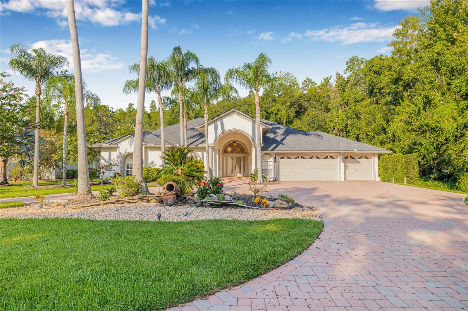 WOW-situated on a sprawling 1.19-acre CONSERVATION lot with no rear or side neighbors, this stunning Saddlebrook pool home offers unparalleled privacy and space in one of Wesley Chapel’s most desirable gated communities! Tucked behind the 24-hour manned gates of Saddlebrook Resort, this beautiful 4-bedroom, 3-bath, 3-car garage home spans 3,418 square feet. From the moment you arrive, the circular driveway, manicured landscaping, and elegant elevation make a grand first impression. Step inside to soaring 10-foot ceilings with crown molding and coffered details, plantation shutters, and a desirable split floor plan. The formal living and dining rooms provide the perfect backdrop for entertaining, while the expansive family room with a wet bar offers a relaxed gathering space for everyday living. The overlooks the pool and features granite countertops, a center island, breakfast nook, and appliances including dual wall ovens, a cooktop, convection microwave, and more. The luxurious primary suite is your personal retreat, featuring a cozy sitting area with gas fireplace, French doors leading to the lanai, dual walk-in closets, and a spa-inspired bath with a jetted tub, separate shower and 2 separate vanities. Step outside and enjoy true Florida living in your private oasis. The screened, saltwater, heated pool is surrounded by serene conservation views, covered seating areas, and a tranquil waterfall feature that sets the tone for relaxation. A built-in cooktop and sink on the lanai make outdoor entertaining effortless, whether it’s a weekend barbecue or sunset dinner party. Additional highlights include generous closet space, a spacious 3-car garage, split bedroom layout, dual-zone HVAC, gas dryer, and numerous recent upgrades including a NEW ROOF (2024), water heater (2021), and water softener. Low HOA includes cable and internet! Located near the front of the community for quick access to I-75, hospitals, schools, shopping, dining, and all that Wesley Chapel has to offer. Spend your weekends at The Grove, the Shops at Wiregrass, or Tampa Premium Outlets or unwind with a craft brew at Florida Avenue Brewing. And there’s more, Saddlebrook Resort is in the midst of a $92 million transformation, including a full-scale golf course reimagining by famed architect Rees Jones, converting two 18-hole layouts into a dynamic 27-hole championship experience. Enjoy access to 43 tennis courts, 8 pickleball courts, a modern fitness center, spa, and a new multi-court padel complex on the way. This is not just a home, it’s a lifestyle. Call today for your private tour.
