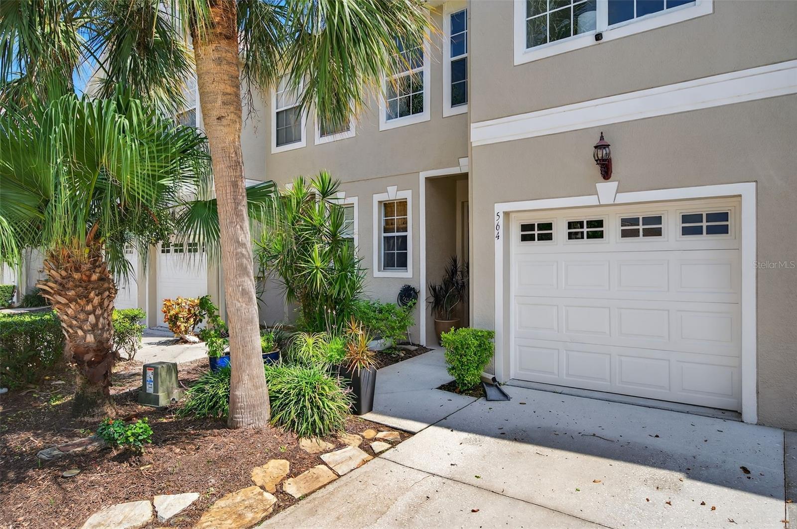 Stunning Townhome with $50,000 in Upgrades! From the moment you walk in, you’ll feel the difference. The entryway greets you with elegant crown molding, custom wainscoting, and freshly painted walls and ceilings. The kitchen is fully updated with new cabinetry, granite counters, sink, disposal, and upgraded GE appliances (refrigerator, microwave, dishwasher all new in 2023). Custom plantation shutters add charm, while the enclosed sun porch with new windows and glass door creates the perfect home office or reading nook. The backyard deck is only one year old with nothing but preservation/greenspace behind you. Thoughtful details are everywhere: Built-in storage cubby under the stairs. Professional closet systems. Extra hallway ceiling storage. All new pressurized toilets. Remodeled bathrooms with new fixtures, marble tile, marble vanity tops, and in the primary suite, a spa-like walk-in shower with rain showerhead, built-in bench, and upgraded vanity. The flooring is just as impressive—tile throughout the first floor and hardwood upstairs, with wood stairs enhanced by a beautiful open banister in place of the original builder's half-wall. Other updates include: Professionally painted garage with added shelving. Recently replaced roof. (2022, by HOA) Home exterior freshly painted. Washer & dryer included. Window treatments and upgraded ceiling fans throughout. Community Lifestyle: Wyngate at Brighton Bay offers one of the lowest HOAs in St. Petersburg for a three-bedroom townhome, while delivering resort-style amenities: Olympic-sized pool, Tennis courts (with pickleball), Half basketball court, Sand volleyball court, Playground. Scenic walking trails around the ponds. Pet friendly! Prime Location: just 10 miles to Downtown St. Pete, 15 miles to Tampa, 18 miles to Clearwater, and only 30 minutes to the Gulf beaches. Minutes to Old Tampa Bay, the Gandy Bridge, and I-275. Conveniently close to both airports (TPA ~12 miles, PIE ~6.5 miles). Don’t miss this opportunity to own a beautifully updated home in one of St. Pete’s most sought-after communities. Come to live, but stay to play. Welcome home! PS. Peace of Mind: Located in a no-flood zone with a strong retention wall—Wyngate has never experienced flooding or standing water, even during last year’s storms.