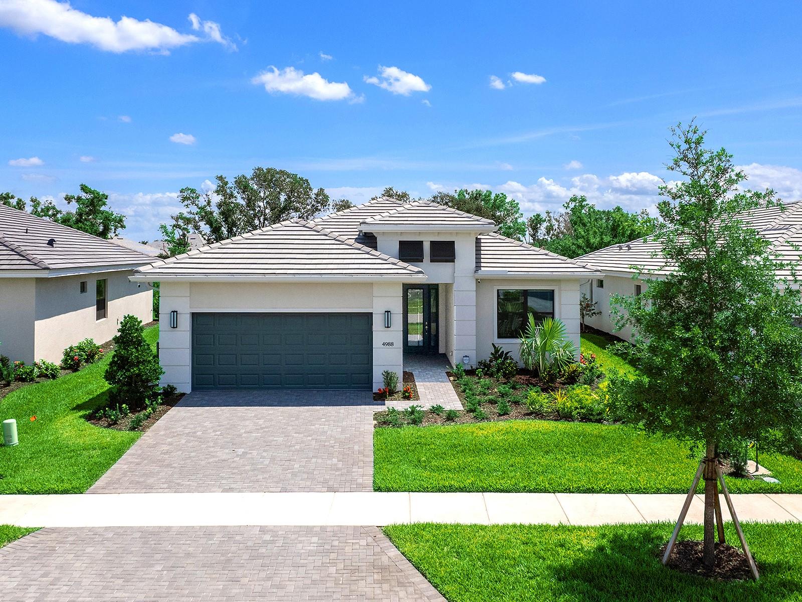 One or more photo(s) has been virtually staged. This beautiful new Kolter-built pool home is in the exclusive 55-plus active adult community of Cresswind in Lakewood Ranch, America’s top multi-generational community! The desirable three-bedroom, three-bath with den Fiesta floor plan offers a combination of style and functionality with thoughtfully designed gathering spaces that make it an ideal fit for the active Florida lifestyle. The heart of the home is a delightful gourmet kitchen which contains a six-burner gas range-top with canopy hood, built-in convection double wall oven, an oversized 48-inch side-by-side refrigerator, a large center island, solid wood cabinetry with soft-close doors and drawers, Cambria quartz counters and a herringbone design tile backsplash. Centrally located, the kitchen opens seamlessly to the spacious great room and dining area – ideal for everyday living and effortless entertaining. Sliders in the great room lead to the lanai, creating an inviting indoor-outdoor connection for hosting gatherings or enjoying quiet evenings. At day’s end, the spacious primary suite offers a peaceful retreat at rear of the home. It includes an expansive walk-in floor-to-ceiling tiled shower with frameless glass, dual vanities with quartz counters and a sizable walk-in closet. Two guest bedrooms with ensuite baths are in the front of the home to provide additional privacy for guests. Go outside to the inviting paver lanai, with the refreshing pool, or relax under the covered seating area and enjoy the privacy provided by the preserve setting and distant pond views when looking left or right. Some of the additional features include a transferable builder warranty, hurricane-impact glass doors and windows, spray foam insulation in the attic, pre-plumbed summer kitchen, coffered ceilings, double French doors in the den, continuity of wood laminate flooring throughout, solid core eight-foot interior doors, solid wood soft-close cabinets with Cambria quartz counters in each bath, laundry room with cabinets and sink, and an epoxy finish garage floor. Included in the sale are the following new items: two Samsung televisions, Speed Queen washer and dryer, king-size bed frame and mattress, and additional items. Cresswind is an amenity-rich, pet-friendly community that features a resident-exclusive clubhouse served by a full-time lifestyle director with a multi-purpose lawn, fitness center, yoga studio, art studio with ceramics, cardrooms and various social clubs. Outdoor amenities across Cresswind’s 250 acres include pickleball, tennis and bocce courts, walking trails, resort-style pool and hot tub, resistance pool, food truck events, two dog parks, outdoor social areas and more. Embrace this opportunity to live in an amazing home while enjoying an active lifestyle in this wonderful community.