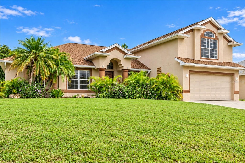 Photo of 447 Ravenswood Boulevard, Port Charlotte, FL 33954 (MLS # C7532179)