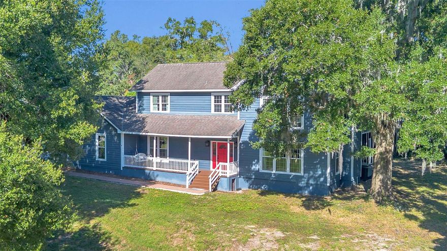 This traditional farmhouse blends Old Florida charm with everyday comfort — a rare opportunity in the heart of Windermere. Full of character inside and out, the home sits on an elevated corner lot, offering room to play and beautiful curb appeal. A welcoming front porch invites you to slow down, relax, and enjoy the neighborhood setting.
Step inside to original wood floors that extend throughout the main living areas, enriching the home with warmth and timeless appeal. The family room centers around a charming wood-burning fireplace, surrounded by newly installed windows (2020) that fill the space with natural light.
French doors open to a large screened porch — an ideal spot for morning coffee, outdoor dining, or unwinding beneath the shade of mature trees.
The island kitchen features granite countertops and generous workspace for cooking and entertaining. The first floor includes a full bedroom and bath, perfect for guests or a home office.
Upstairs, the spacious primary suite offers a peaceful retreat, joined by two additional bedrooms and the convenience of a second-floor laundry room.  New Septic and drain field 2020, A/C 2024, Well re-sleaved and new pump 2024.
A partially air-conditioned, three-car garage provides excellent storage and space for vehicles, golf carts, or weekend adventure gear.
Stroll or golf-cart your way to cafes, shops or the local brewery. Spend weekends at town parks, tennis and pickleball courts, or out on the world-famous Butler Chain of Lakes. With no HOA dues, tree-lined streets, and the peace of mind of a dedicated police department, Windermere combines natural beauty, community charm, and everyday convenience.