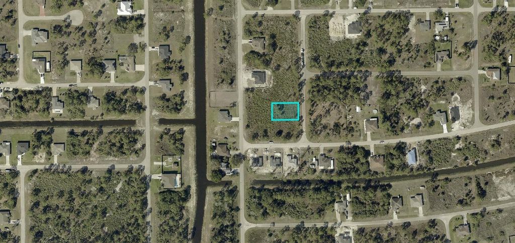 Photo of 820 Bajo Avenue S, Lehigh Acres, FL 33974 (MLS # A4680345)