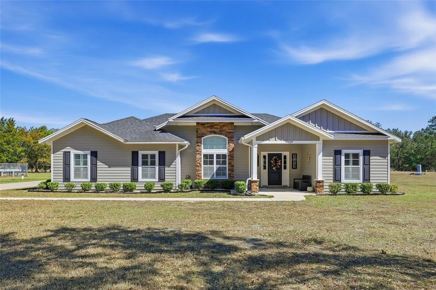 Welcome to a private countryside retreat where timeless ranch style living meets comfort and natural beauty. Situated on 12.26 peaceful acres, this beautiful four bedroom, two bathroom home offers space, privacy, and a lifestyle surrounded by nature, with one bedroom perfectly suited to be converted into a home office or flex space.

Inside, warm wood flooring flows throughout the home, creating an inviting and cohesive feel across the living spaces. Large windows bring in natural light and showcase serene views where deer and wild turkey can often be seen right from your living room, offering a daily connection to the surrounding landscape.
Outdoors, the property truly shines with a fenced private pool designed for relaxing afternoons and effortless entertaining. The expansive acreage includes a barn and a spacious shop or storage building complete with a covered two car carport, providing endless possibilities for hobbies, equipment, or recreational use. With three wells, three septic systems, and an existing RV hookup, the property is thoughtfully equipped to support additional dwellings, making it ideal for multigenerational living, guest accommodations, or future expansion opportunities.

Private, peaceful, and beautifully maintained, this property offers a rare opportunity to enjoy refined country living with room to grow, space to breathe, and endless potential.