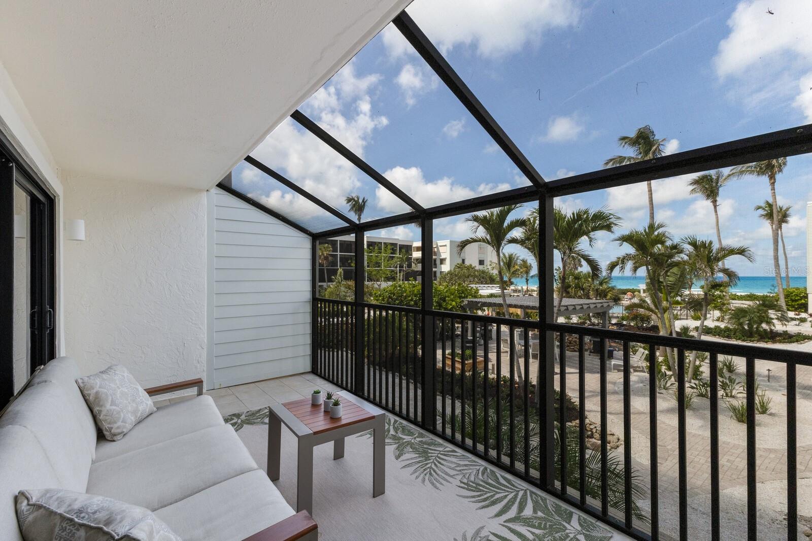 Located on the most treasured stretch of beach on Boca Grande, this 2-bedroom, 2-bath condominium in a pristine gated community welcomes you with a beautiful view through the tropical courtyard to The Gulf. As a corner residence, it benefits from added natural light with extra windows in both the kitchen and master bedroom.
The spacious floor plan offers comfortable living with generous room sizes and an easy flow throughout. Positioned on the first floor above parking and private storage, the property features a breakfast bar in the dining area ideal for casual meals or relaxed gatherings with family and friends. A unique highlight is the double screened lanai layout, offering two expansive outdoor living areas perfect for enjoying Gulf breezes, quiet mornings, or entertaining in a peaceful tropical setting.
The building exterior has been refreshed with a crisp white finish and bluish-green accents on the HardiePlank siding. The lush courtyard includes a heated swimming pool with expanded decking for sunbathing, a heated spa, and two BBQ areas. Recently upgraded tennis courts, elevators, and on-site management further enhance the experience.
With world-class fishing, golf, shopping, and top-rated restaurants just minutes away, this is a must-see!