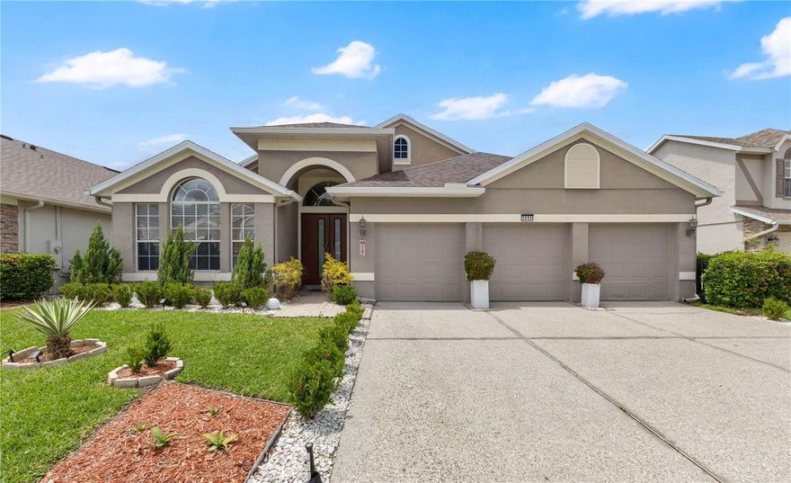 Welcome to this stunning, UPDATED 4-bedroom, 3-bathroom home located in the highly desired Cypress Springs neighborhood! From the moment you arrive, you'll be captivated by the elegant FROSTED GLASS front doors and 3-CAR GARAGE. Step inside to find beautiful porcelain tile flowing throughout the main living areas, complemented by wood flooring in the private office and secondary bedrooms. To the left of the entry, a dedicated HOME OFFICE with an adjacent full bathroom offers the perfect work-from-home setup. The SPACIOUS dining and family room combo provides an abundance of room for gathering and entertaining. The kitchen is truly the heart of this home, featuring DARK WOOD cabinetry, solid surface countertops, STAINLESS STEEL appliances, a LARGE CENTER ISLAND, a BUILT-IN desk workstation, a WINE RACK cabinet, and a refrigerator with DUAL pull-out freezers, all overlooking the bright living room with natural light. FRENCH DOORS lead you to your backyard, where beautiful LAKE VIEWS, PAVERS, a cozy GAZEBO, and a FIRE PIT await! The EXPANSIVE PRIMARY SUITE is a true retreat, featuring MARBLE FLOORING, GLASS SLIDING DOORS to the backyard, and an ENSUITE BATHROOM complete with DUAL SINKS, a dedicated VANITY area, MARBLE TILE, a CLAWFOOT SOAKING TUB, and a stand-up shower. A thoughtfully converted dinette serves as a luxurious CUSTOM WALK-IN CLOSET with BUILT-IN shelving and DIRECT ACCESS to the laundry room, which is equipped with a convenient LAUNDRY SINK. Two additional bedrooms and a full bathroom, with the added convenience of outdoor access, round out the home. Conveniently located with EASY ACCESS to FL 417 and 408, Cypress Springs Elementary, Waterford Town Lakes shopping and dining, and just MINUTES from the University of Central Florida, this home perfectly blends luxury, comfort, and convenience! Don't miss your opportunity, schedule your private tour today!
