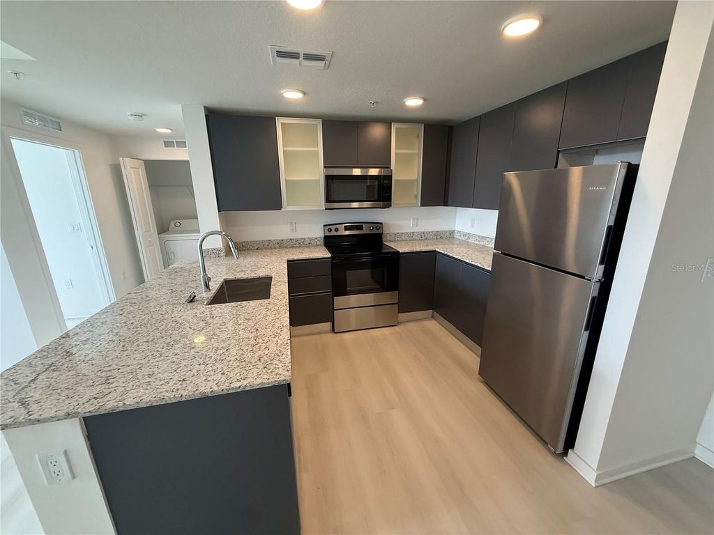 Photo of 5579 Millenia Park Blvd #424, Orlando, FL 32839 (MLS # O6399272)