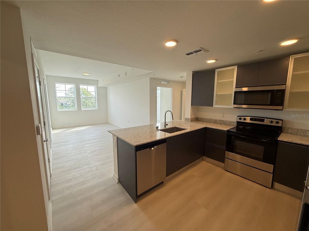 Photo of 5579 Millenia Park Blvd #424, Orlando, FL 32839 (MLS # O6399272)