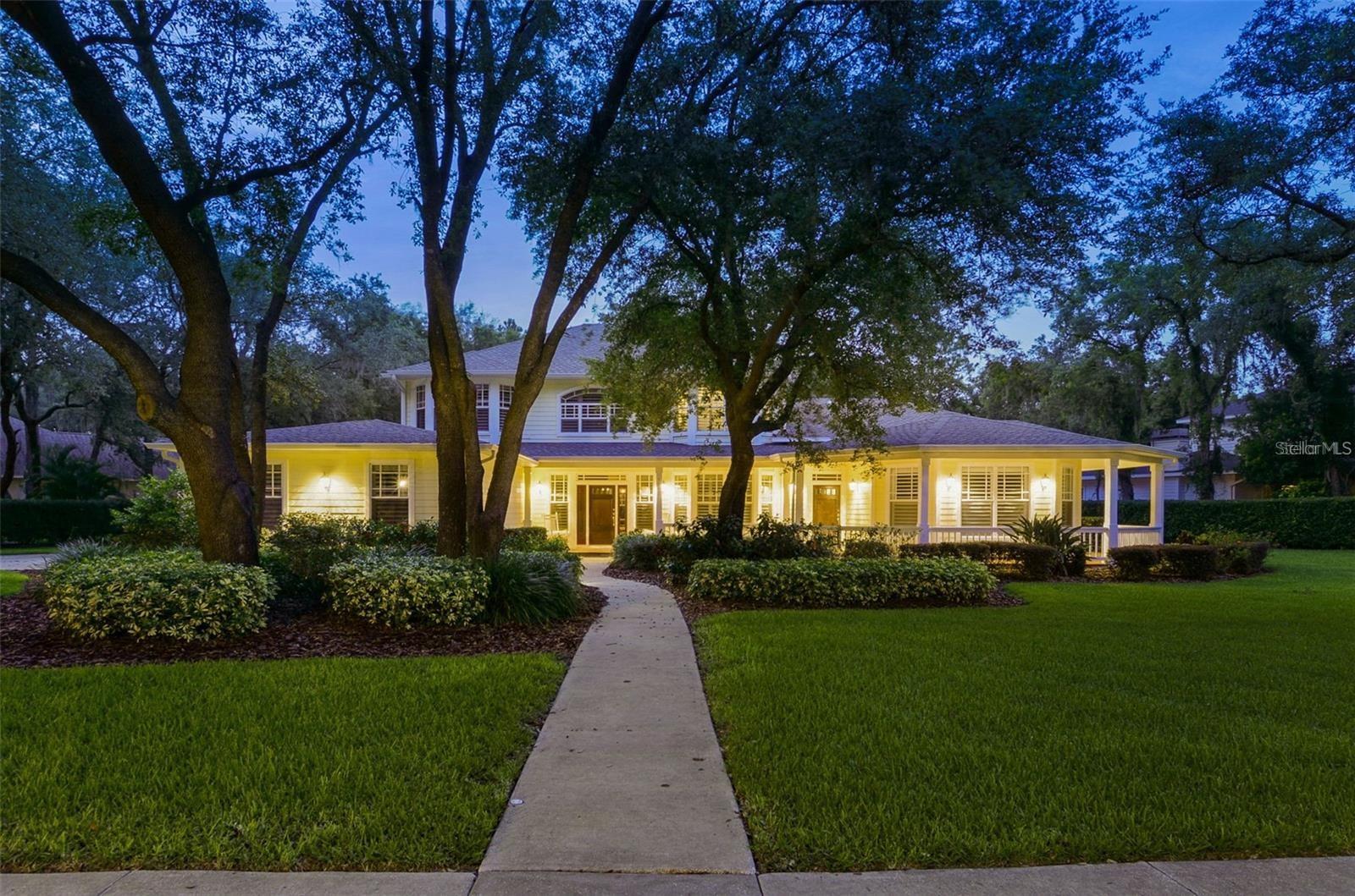 A Real Southern Charmer located in the exclusive, 24 hr. Gated community of Fish Hawk Trails! **Special Features include a Mother In Law Suite and ** A MOVIE THEATER *** MIL with its own private entrance, Bedroom, Walk in Closet, ADA Bath, Kitchenette. This home is ideal for multi-generational living. This Home will Not Disappoint! A Sprawling Custom home boasts just under 4300sqft of Living Space and sits on just under a 1 ACRE Lot! Park-like curb appeal and an impressive craftsman style elevation command your attention from the minute you arrive. So pretty. As you walk up notice the handsome hardi plank siding and expansive wrap around porch! Step inside and absolutely you will fall in love. As you explore this beautiful home, take in all the amazing upgrades and attention to detail throughout. This home has it all and more. Obvious upgrades include crown moldings, 1” thick hardwood floors, Plantation Shutters (in 35 windows), 4 independent air conditioners with Reme halo air purification, 2 laundry rooms, air-conditioned home gym w/sauna, a Home office, updated bathrooms, 2 Tankless Hot water heaters, Bay Windows, 3 car side load garage and more. The special features beyond the obvious include a premium home theater with 8 luxury leather reclining chairs, 4K projector, 4 Sub Woofers, 7 Surround sound speakers, 150” Movie Screen, and a theater kitchen with microwave and refrigerator. This space could be easily converted into a multi gen./mother-in-law suite. There is a 38kW Whole Home Generator with dedicated 500-gallon propane tank will power the entire home for 7 days (if there is a power outage). The home is energy efficient with Double pane windows in the master suite and Icynene foam insulation in the attic and addition walls reducing your monthly electric bills. This home has a very large first floor guest suite with walk in closet and en-suite bath that can be a second (1st floor) master. Your spacious master suite offers a large walk in closet and luxurious bath with dual sinks, vanity, exquisite pedestal tub, ginormous glass enclosed steam shower. All the secondary bedrooms are generously sized with large closets and plenty of storage space. Explore the private backyard and you will find a lark deck around your sparkling pool (salt water system and new heater) travertine walkways for external paths, gutters on the entire home and a huge fenced yard beyond the screened in lanai. This Truly Amazing Home is a Must see in Person! Located in a 24 hour gated community featuring Top Rated Schools and convenient to Everything! Showings By Appointment Only, Call Today and Schedule A Private Tour!