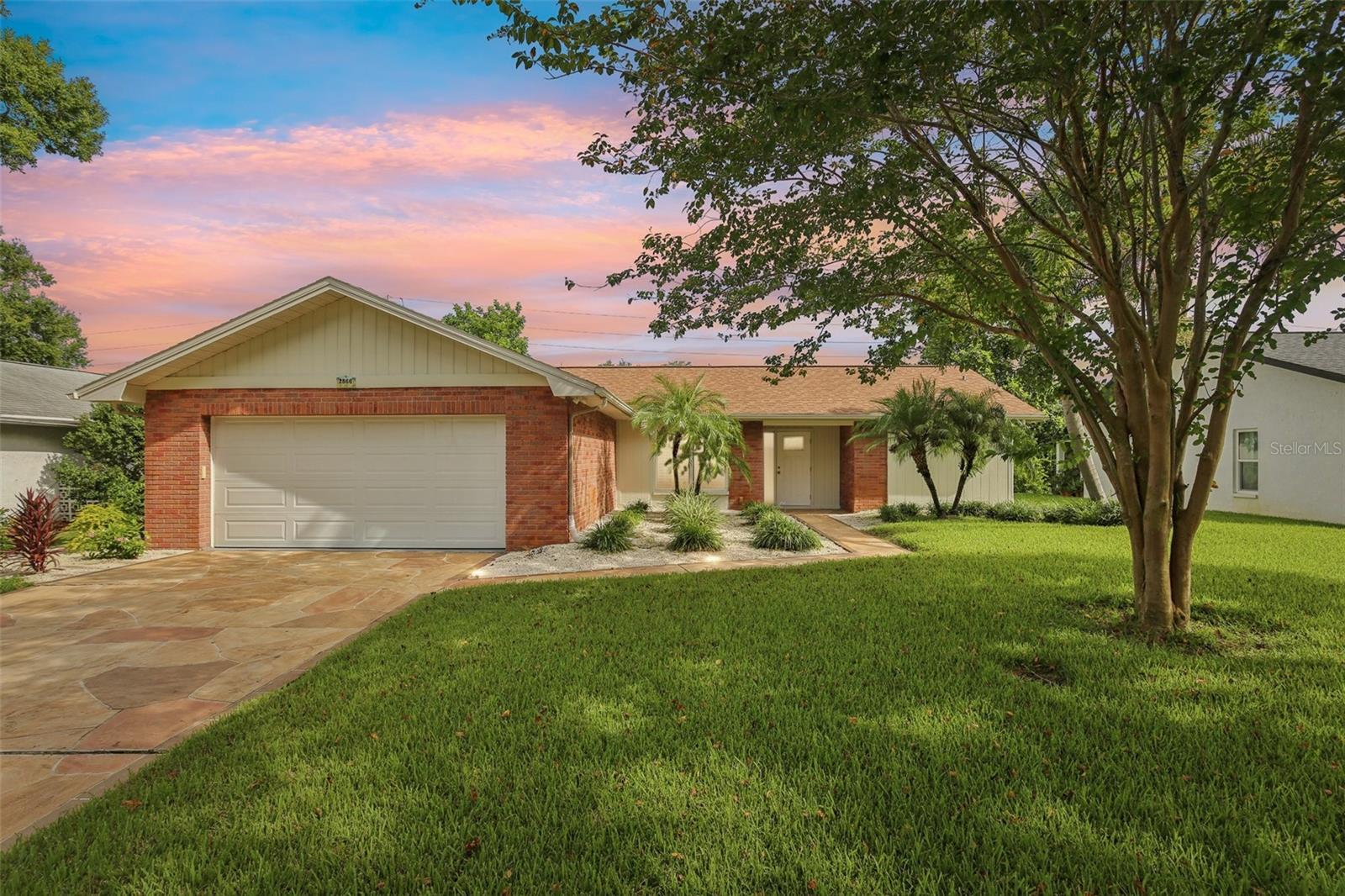 Discover the perfect blend of comfort, style, and community in this beautifully renovated home, nestled in Palm Harbor’s premier 55+ golf community. From the moment you step inside, you’ll notice the thoughtful upgrades: fresh paint, new interior doors, elegant crown molding, and brand-new bathrooms. Luxury vinyl floors flow throughout, while abundant natural light and a rare wood-burning fireplace add warmth and charm.
The updated kitchen is a true highlight, featuring granite countertops, self-closing cabinets, and new stainless steel appliances. It opens seamlessly to a cozy sitting area and the oversized Florida Room—perfect for hosting friends or simply enjoying a quiet morning coffee.
Your spacious master suite is a private retreat with a den/office, walk-in closet, and spa-style bath with a step-in shower. Say goodbye to popcorn ceilings—this home has been fully modernized with today’s finishes.
Major systems have been taken care of so you can move in with confidence: a newer electrical panel, on-demand water heater (2025), HVAC (2020), and a whole-house water filtration system. The roof is protected with Roof Max coating, extending its life and providing peace of mind. Add in a cost-saving deep-water well, and this home is truly turn-key.
Highland Lakes is known as Tampa Bay’s best value in 55+ living. Residents enjoy free green fees on three private executive golf courses, plus pickleball, tennis, bocce, shuffleboard, 3 pools and beginner clinics to try something new. The clubhouse buzzes with fitness classes, entertainment, and social events, while the Arts & Crafts Annex features woodworking and creative studios. At Lake Tarpon Lodge, you’ll find a heated pool, fishing pier, picnic areas, and community pontoon boats. Free RV and boat storage, a secure lot, and a private boat ramp make life here even more convenient.
This isn’t just a house—it’s a gateway to the lifestyle you’ve earned. Schedule your private showing today and experience why Highland Lakes is the premier 55+ golf community in Tampa Bay!