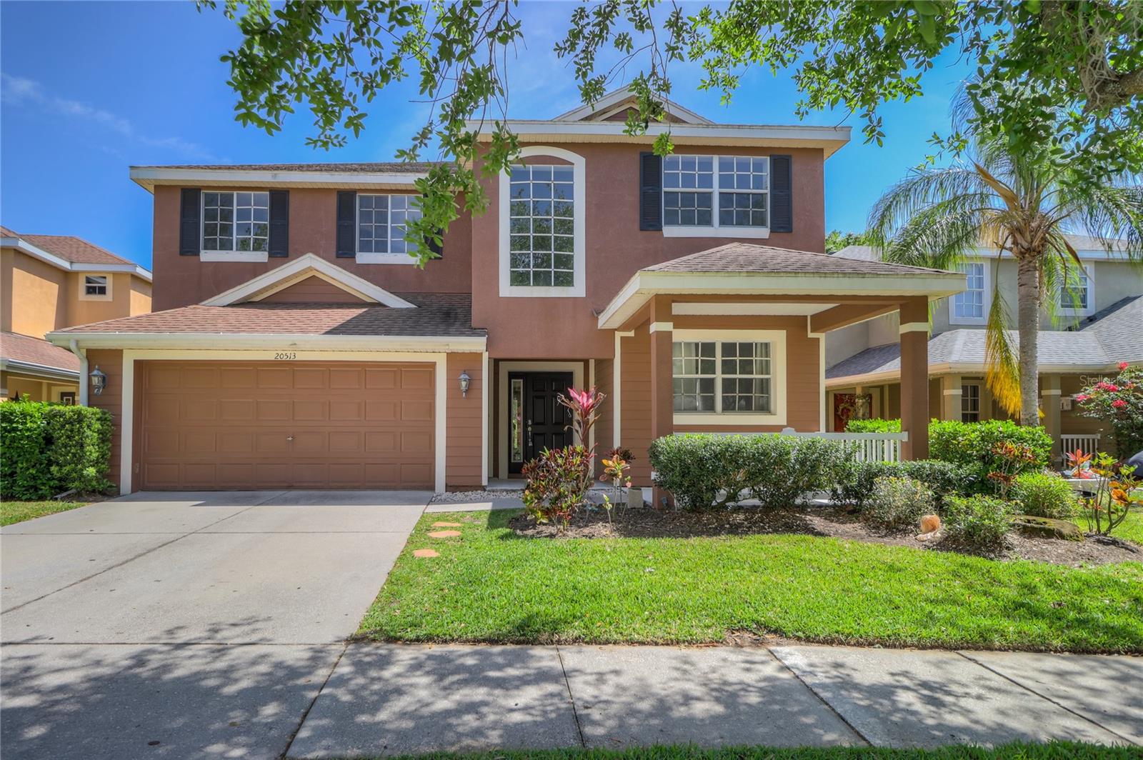 Gated Community! Conservation Views! Great Schools! Freshly Painted! Brand New Vinyl Plank Wood Flooring! This stunning single-family home is located in the prestigious, resort-style, gated community of Live Oak Preserve in New Tampa. This impeccable, move-in-ready model is perfect for anyone seeking a gorgeous home with a desirable floor plan. This two-story home boasts 4 spacious bedrooms, 3 full bathrooms, a 2-car garage, an oversized loft, and a study, with 3,389 heated square feet of living space. The gourmet kitchen features granite countertops, 42-inch staggered cabinetry, a built-in microwave, and stainless steel appliances. It’s a chef’s dream, complete with a cozy eat-in kitchen area with beautiful conservation views. The marvelous master suite includes a garden tub, a separate walk-in shower, two walk-in closets, and Corian countertops. Step into your own backyard oasis—an entertainer’s dream with a large lanai, perfect for hosting gatherings or simply relaxing. There is one bedroom located downstairs for convenience. Situated in the premier Live Oak Preserve community, you’ll have access to fantastic amenities, including a grand community club room, a multi-use aquatic center with resort-style swimming pools, a fitness room, tennis courts, and a playground. Conveniently located near I-75, I-275, Wiregrass Mall, restaurants, a movie theater, businesses, and a new hospital.