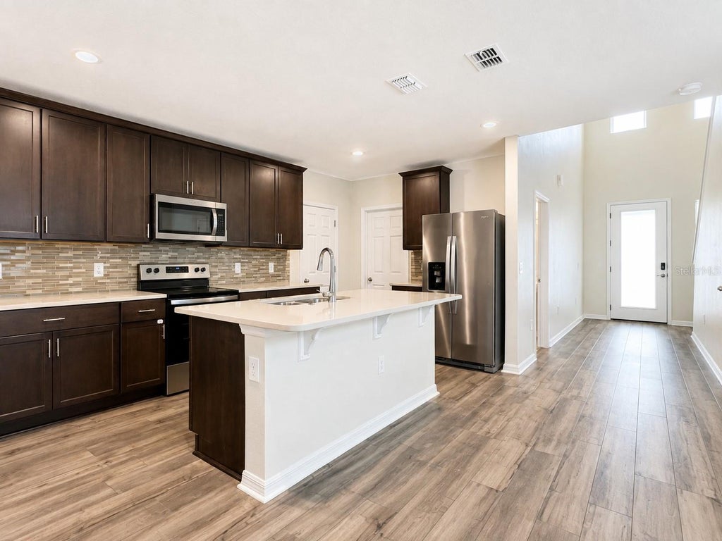 Photo of 17124 Cagan Crossings Boulevard, Clermont, FL 34714 (MLS # O6436881)