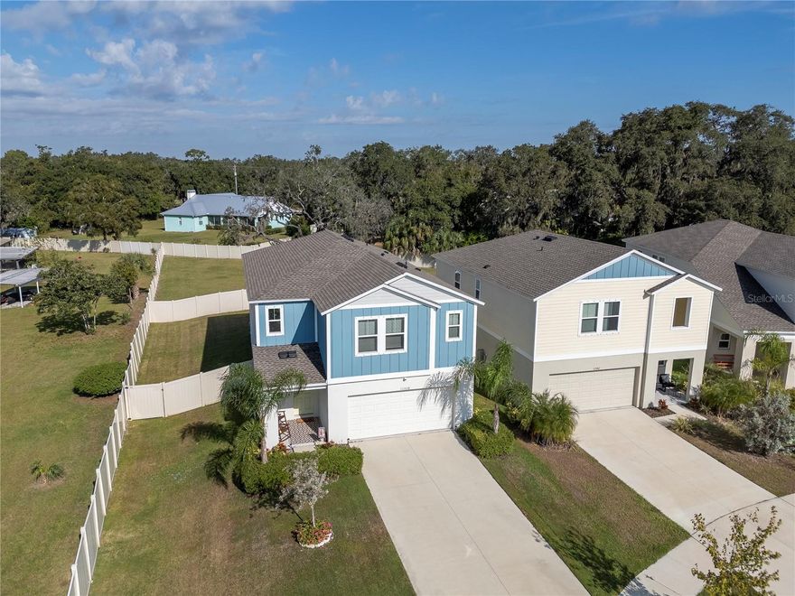 LOCATION!! Built in 2023, this move-in ready Casa Fresca “Indigo” open concept and split floor plan offers over 2500 SF with 5 bedrooms, 3 full baths, Loft, 2-Car Garage, extended driveway, large front yard, oversized backyard, FULLY FENCED. NO CDD, LOW HOA!  Located in the sought-after Bell Creek Landing community in Riverview! The open concept main floor welcomes you with high ceilings, recessed lighting, and tile flooring that flows seamlessly through the foyer, dining area, and great room. A guest suite and full bath on the first floor create the perfect setup for visitors or multi-generational living. The chef’s kitchen stands out with quartz countertops, soft-close cabinetry, subway tile backsplash, stainless steel GE appliances, and a gas range—all overlooking a spacious living area with natural light pouring in through sliding glass doors to the fenced backyard. Upstairs, a generous loft provides space for a home office, theater, or playroom. The primary suite is a retreat of its own, featuring a massive walk-in closet and a spa-inspired bath with dual quartz vanities, soft-close cabinetry, and a walk-in shower. Three additional bedrooms, a full bathroom, and a laundry room complete the upper level, offering both function and flexibility for family and guests. Outside, enjoy a fully fenced yard with room to add a pool, and a swing set that already comes with the house — perfect for outdoor entertaining or quiet evenings at home. Additional highlights include a two-car garage, gas tankless water heater, irrigation system, hurricane panels and more. Bell Creek Landing is one of Riverview’s most charming and connected neighborhoods—offering a community playground and a prime location next to Riverview High School. With quick access to I-75, I-4, and the Selmon Expressway, you’re just minutes from Tampa, Brandon, and all of Tampa Bay’s shopping, dining, and entertainment destinations. If you’ve been searching for a home that truly checks every box—modern construction, smart layout, and a location that delivers—it’s here at 11338 Brook Edge Avenue. Homes like this don’t last long; schedule your private showing today. Roof, AC, and Water Heater all 2023.