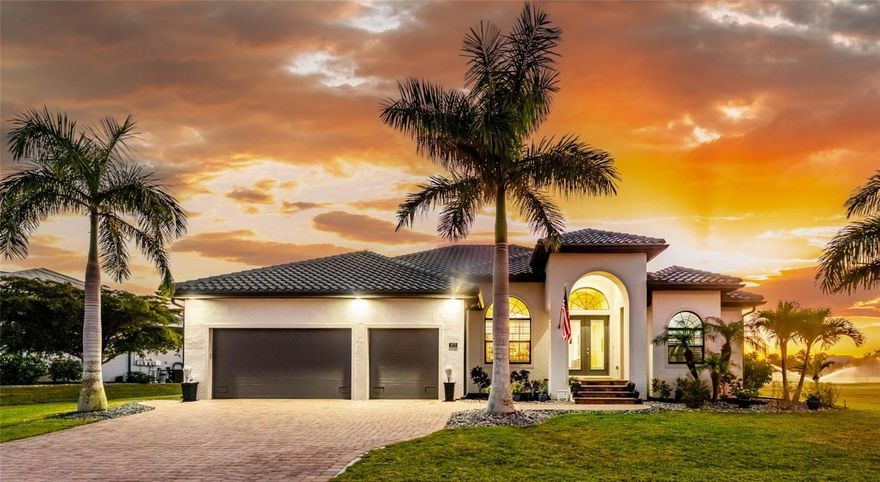 This beautiful custom crafted home offers the perfect blend of style, quality, and effortless indoor-outdoor living, set on an oversized lot overlooking the eighth fairway of the private St. Andrews South Golf Club. Built in 2018, the home welcomes you with soaring thirteen foot ceilings, tile flooring throughout, elegant architectural details, and abundant natural light.
The open great room showcases a striking double tray ceiling and flows seamlessly into the gourmet kitchen, featuring rich wood cabinetry, granite countertops, GE stainless steel appliances, and a sunlit sitting or dining area.  Expansive disappearing and zero-corner glass doors erase the boundary between indoor and outdoor living, opening the space for relaxed living and entertaining.
The spacious primary suite features a double tray ceiling, two walk-in closets, and a luxurious ensuite bath with a soaking tub, walk-in shower, and dual-sink wood vanity topped with granite. Two generously sized guest bedrooms are nicely paired with beautifully appointed bathrooms highlighting wood cabinetry and granite countertops, including a convenient pool bath - perfect for hosting family and guests in comfort and style. A refined and versatile office or den offers an ideal retreat for working from home, enjoying media, or quiet time alone. 
Step outside to your private oasis, where a sparkling pool and spa is surrounded by new brick pavers, lush tropical landscaping, and an expansive lanai complete with a fully equipped summer kitchen featuring a built-in grill, sink, and refrigerator—perfect for year-round entertaining. Enjoy morning coffee or unwind with an evening cocktail while watching golfers pass along the picturesque fairway.
Additional features and enhancements include a new 2025 barrel tile roof with transferable warranty, crown molding throughout, plantation shutters, hurricane-impact windows, a recently enlarged brick-paver driveway, a 3-car garage with epoxy-finished flooring, new lighting fixtures and ceiling fans, new pool mechanicals in 2025, professionally painted in 2025 and no HOA or fees.
Bright, open, and impeccably maintained, this exceptional home is designed for both everyday comfortable living and memorable entertaining.