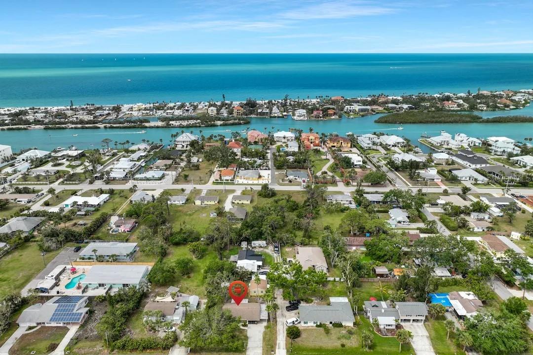 Potential for Income at this rare, property with 2 cottages. Just a short walk to Nokomis Beach! Conveniently located near Waterfront dining, shopping, Marina, Nokomis boat ramp and more! Cottage #1 features 2 bedrooms and 1 bathroom, Tile flooring in spacious living room, eat in kitchen and bathroom/laundry area, Newer Luxury Vinyl floors in both bathrooms. Home also includes a front & rear screened in lanai and a 1 car attached carport. Cottage #2 features 1 bedroom plus den (room is big enough to make into a bedroom) and 1 bathroom, Newer Luxury Vinyl flooring throughout and tile floors in bathroom/laundry area. Home includes a screened large lanai. Each unit includes Wall mounted A/C units, Newer ceiling fans, blinds and curtains. Hot Water heaters were replaced in 2023 and 2024. Roof is 8/9 years old. Plumbing and Electrical in both cottages were updated in 2024. Cottage #2 bathroom was remodeled with a walk in shower. Both Cottages have been freshly painted inside and out. Yard is fenced and includes a shed. No HOA and No Deed Restrictions here! Zoned Multi-family! Check out this Investment property today! LIFE IS SHORT, BUY A BEACH HOUSE!