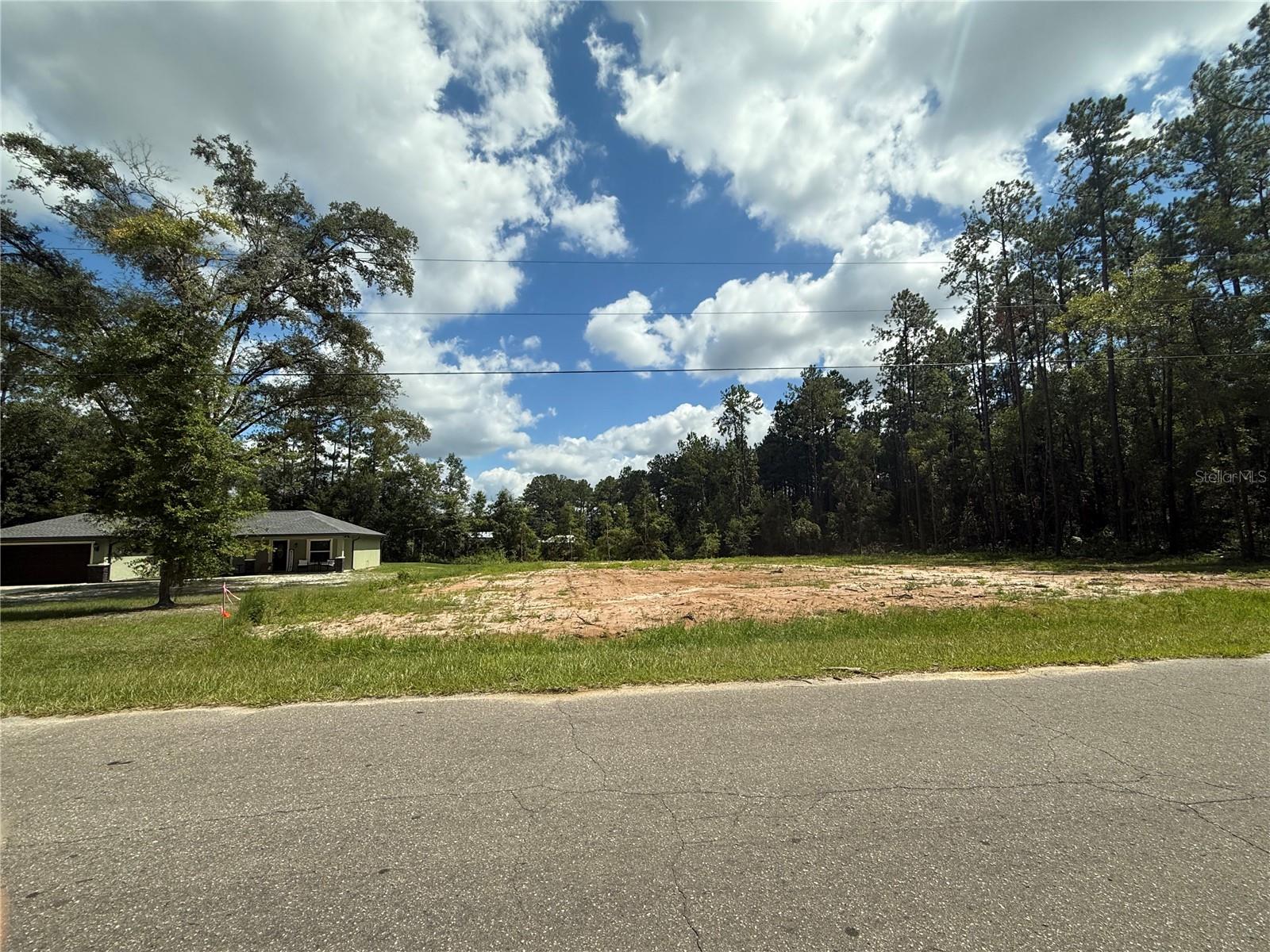 NORTHWOOD ESTATES CLEARED 1/2 ACRE BUILDING LOT. Look no further for the ideal location for your new home. Great location just north of the City and just off State Road 121 (Williston Road) with quick access into Gainesville. Parcel measures about 118' on the road and 183' deep. Zoned R-1 for Single Family homes only with city water available. No HOA and no time limit to build.