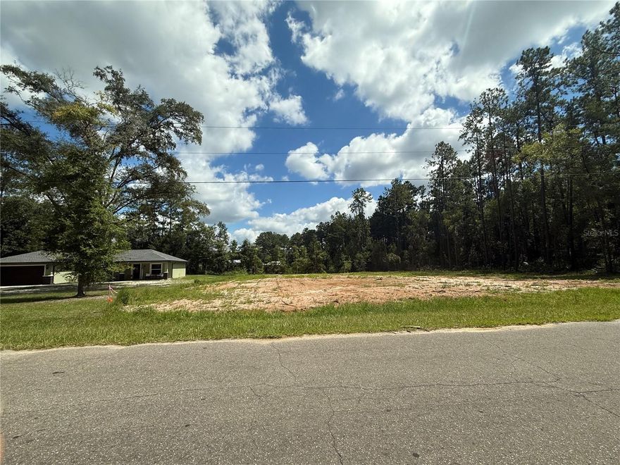 NORTHWOOD ESTATES CLEARED 1/2 ACRE BUILDING LOT. Look no further for the ideal location for your new home. Great location just north of the City and just off State Road 121 (Williston Road) with quick access into Gainesville. Parcel measures about 118' on the road and 183' deep. Zoned R-1 for Single Family homes only with city water available. No HOA and no time limit to build.