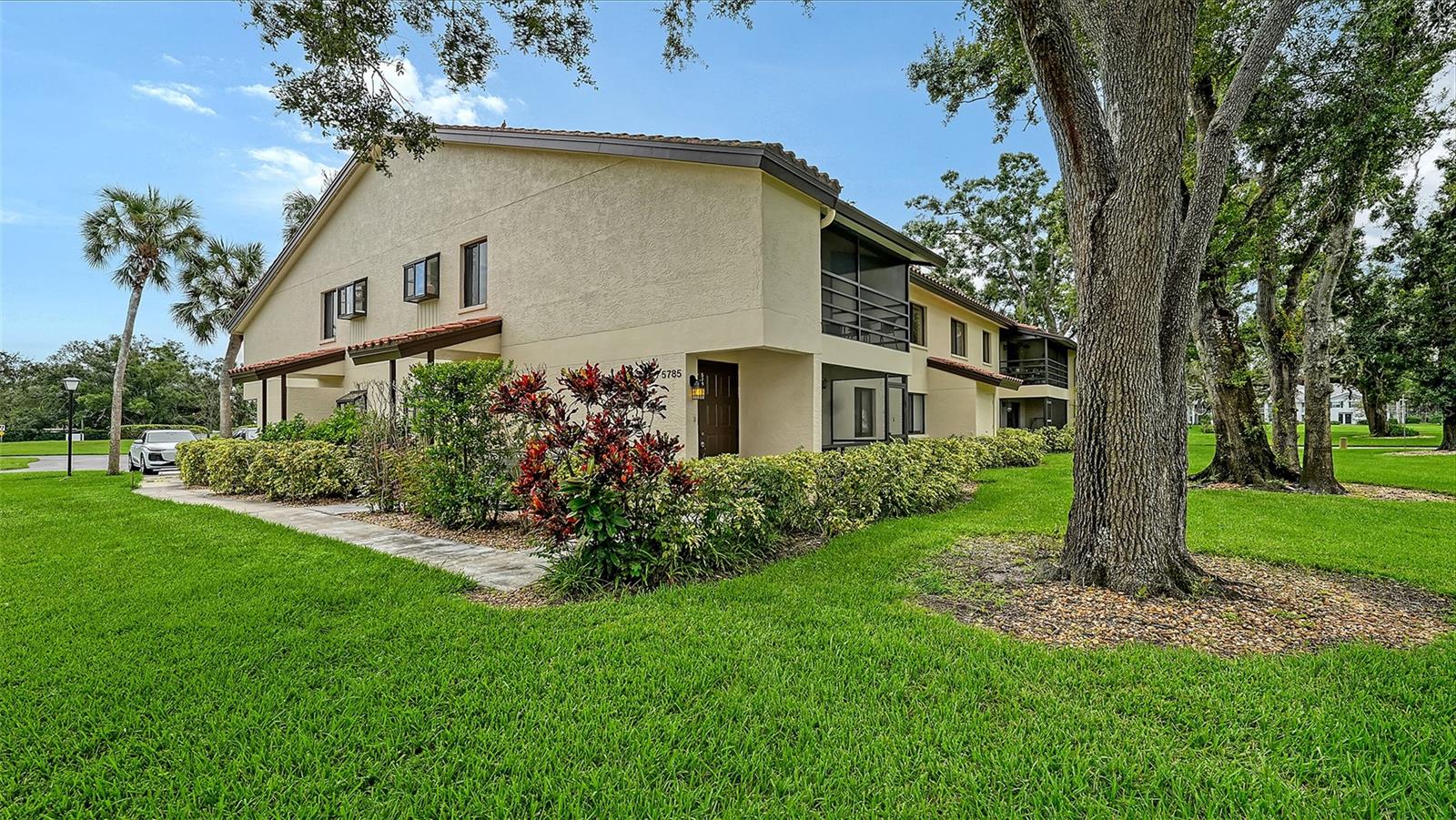 Discover the perfect blend of comfort, convenience, and location with this updated 2-bedroom, 2-bath condo in the desirable Gardens at Palm-Aire community in Sarasota. Whether you're looking for a year-round residence, a seasonal retreat, or a rental investment, this property checks all the boxes. Located on the second floor, the condo offers a spacious 1,080 sq ft layout with an open living and dining area, a functional kitchen pass-through, and a private screened lanai where you can relax and enjoy the peaceful views. The home has been recently refreshed with new interior paint (2025) and a brand-new A/C system (2025), creating a move-in-ready space with peace of mind for the next owner. The primary suite includes a walk-in closet and private bath, while the guest bedroom provides comfort for family or visiting friends. An in-unit laundry adds to the everyday convenience, making this condo ideal for modern living. The Gardens at Palm-Aire is a well-established community known for its beautiful landscaping and welcoming atmosphere. Enjoy a variety of amenities, including a heated swimming pool, clubhouse, shuffleboard courts, and common laundry facilities. The monthly HOA fee covers exterior and grounds maintenance, water, sewer, trash, basic cable, and use of all community amenities making it a truly maintenance-free lifestyle.
