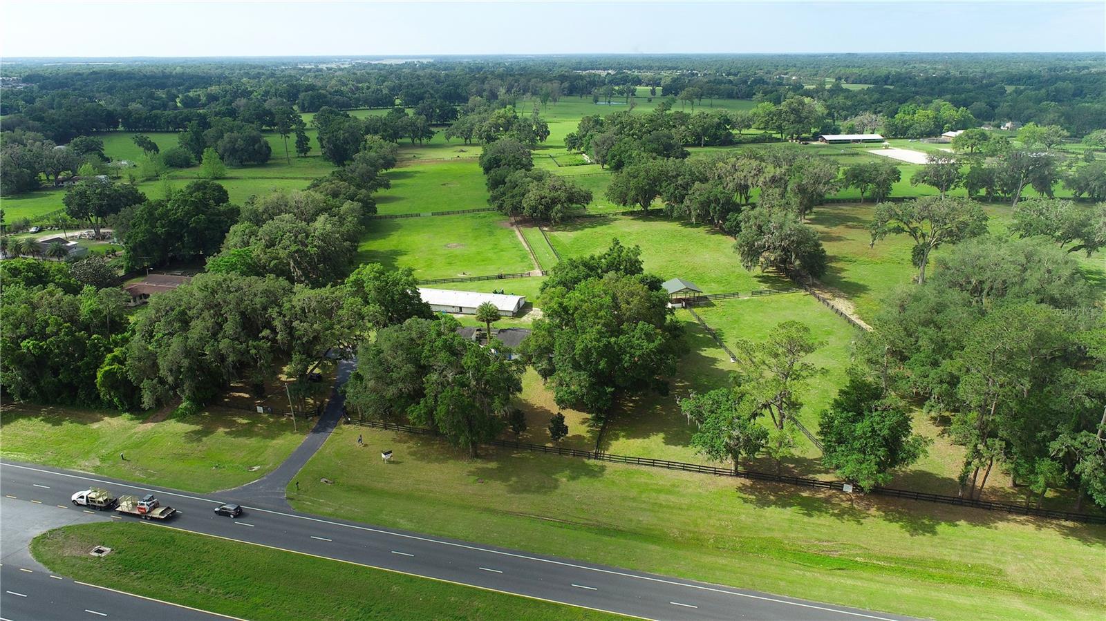 This is the perfect opportunity to build your equestrian farm. This property awaits your dream home and stables. The ultimate location for equestrian enthusiasts! This stunning 76+/- acre estate is nestled in the heart of Central NW Ocala’s renowned horse country, boasting prominent Hwy 27 frontage. Just 1.8 miles away from Golden Ocala and 2.5 miles from the New World Equestrian Center, enjoy convenient access to shopping, dining, and top-tier entertainment. You’ll find other major equestrian venues like HITS and OBS within easy reach, making this an ideal spot for those who live and breathe horses or cattle. The meticulously maintained pastures are board-fenced and elegantly adorned with mature shade trees, creating a picturesque setting for your equine pursuits. Don’t miss this exceptional opportunity to own a premier piece of Ocala’s horse country.