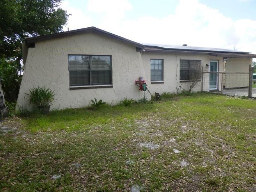 Discover peaceful living in the desirable SunRay community, located just outside Frostproof city limits. This solid 3-bedroom, 1-bathroom concrete block home sits on an expansive lot shaded by beautiful, mature oak trees. Step inside to find durable, easy-to-maintain ceramic tile and laminate flooring throughout—no carpet here! The functional layout includes a single carport to shield your vehicle from the Florida sun. Move outside to your massive, fully fenced backyard, where the stunning oak canopy creates the perfect shaded oasis for pets, gardens, or outdoor entertaining. Best of all, you are centrally located just 1.5 hours from both Tampa and Orlando. Schedule your tour today!