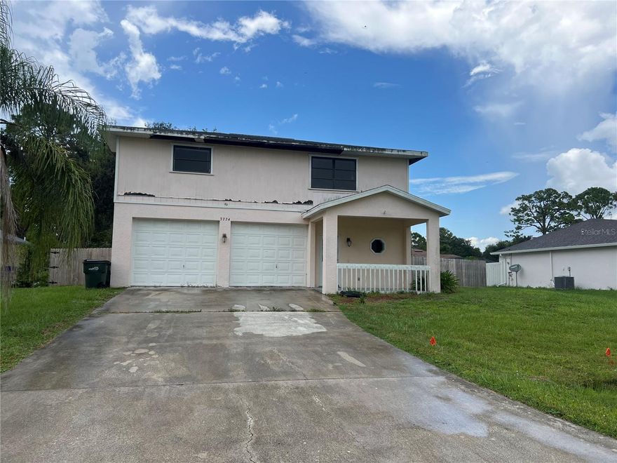 Attention my fixer up peeps! This two story unique North Port Home Features a good sized room on first floor and a bath and laundry facilities. Wall AC. Would make a great teen hideaway or home office or craft area. Slider overlooks the pool! Second story features living room, dining area, two bedrooms and a bath. There is a huge attached garage with back garage door access also! The house has siding issues. Can be cut away and repaired but seller thought best to sell as is. Caged pool with some prior storm damage but fixable. Fully Fenced yard. New in 2023.
Good sized yard! If you are looking for an affordable pool home, this might be the one.