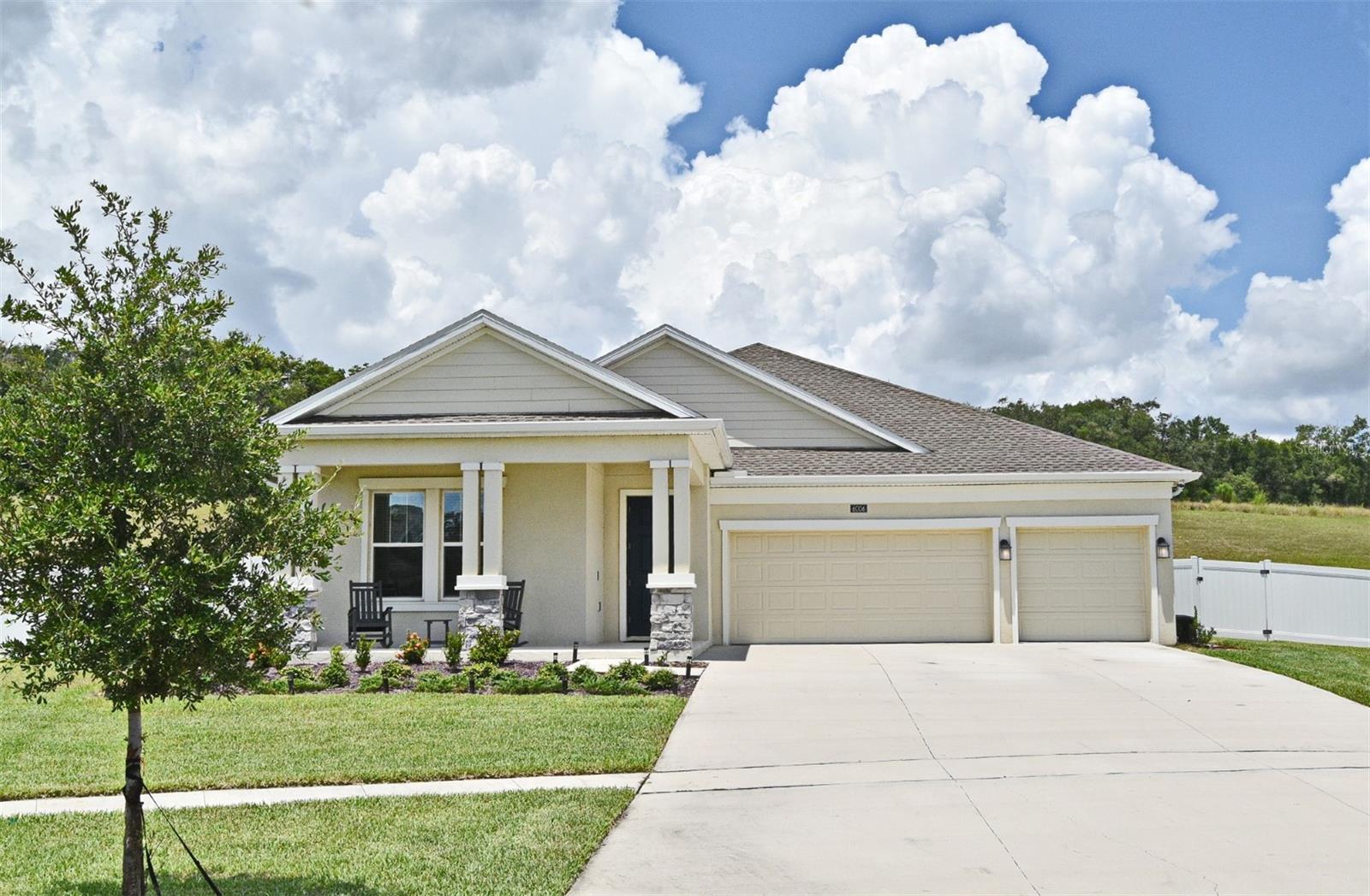 EZ Show !! Welcome to Hillside Estates at Stoney Brook Hills !! This nearly new Lennar "Marina" one-story model with 3 car garage is loaded with many extras such as a Samsung Stainless Steel kitchen appliance package, recently completed additional kitchen cabinetry/coffee bar & storage cabinets below extended island with upgraded solid surface countertops, screened-in rear patio and custom colors throughout the residence. The well planned master retreat also includes a large master bath with dual vanities, a separate tub and shower along with an oversized walk-in closet. A separate entrance to the inside laundry room is also in place. Bedrooms 2 & 3 share a Jack & Jill bath as well. This 3-way split plan offers both tremendous privacy along with very open public spaces. High ceilings throughout the home is an added plus. Situated on one of the largest lots in the community and tucked away in the cul-de-sac offers tremendous privacy. The fully fenced rear yard backs up to a grassy wooded area with no rear neighbors. The easy care ceramic tile extends throughout the high traffic areas of the home. Superior construction consists of low maintenance block and stucco walls with an architectural shingle roof. The leased solar panels assist in lower power usage as well. Conveniently located near the popular downtown area of Mount Dora which offers tremendous restaurant, shopping and boating options. The highway system offers easy access to downtown Orlando, Orlando International Airport and area attractions such as all Disney Parks, Universal & Epic Theme Parks and SeaWorld. Call today for your private tour of this fantastic home and expect to be very impressed !!