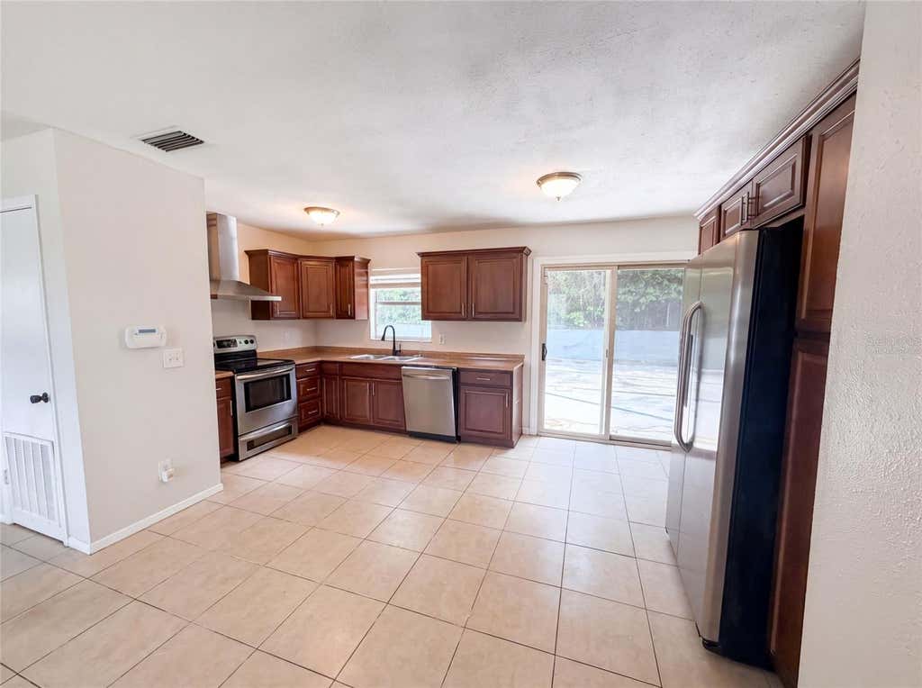 Photo of 7018 Lynwood Drive, Tampa, FL 33637 (MLS # O6432860)