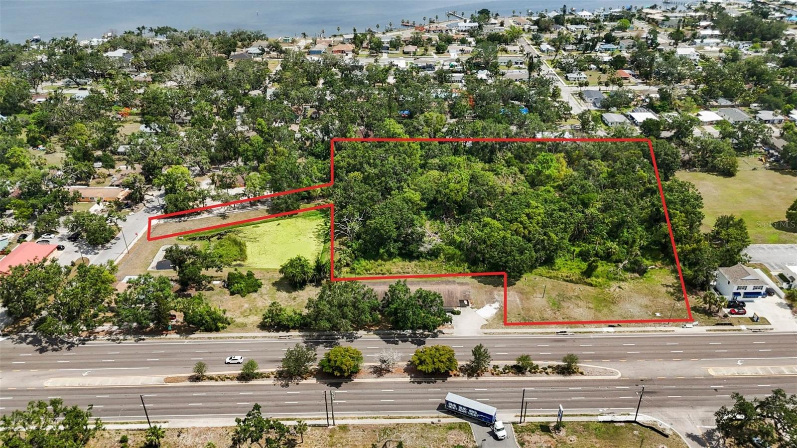 Strategically located near I-75 on Manatee Avenue East (SR 64), this 4.54-acre property sits within the City of Bradenton’s Form-Based Code area and is zoned T4-O (Urban Edge - Open). This flexible zoning supports a mix of residential, commercial, and civic uses, making it ideal for multi-family residential, medical, or mixed-use development.
The site offers excellent access, visibility, and proximity to key amenities, including downtown Bradenton, Manatee Memorial Hospital, and major transportation corridors. Public utilities are available at the site, streamlining the development process.