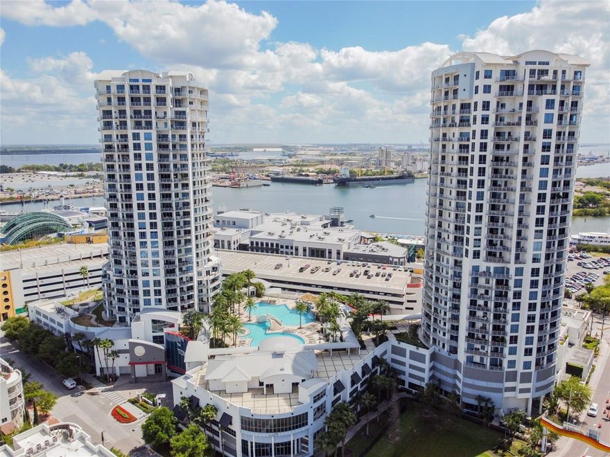 Welcome to The Towers of Channelside built in 2007! This luxury residence comes FURNISHED and is located on the 9th floor of Tower 2, facing east with amazing views of the Port of Tampa, and is available for lease  at a lease rate of $3,400 per month. The 1-bedroom 1.5 bath is approximately 1,136 SF, has an oversized 305 SF balcony, and comes with 1-assigned parking space (#59). 

Everything in this unit is smart; Phillips Hue provides light control via voice with color and dimmable feature. Alexa, programable roomba, remote controlled blinds and Eufy doorbell round out the technology.  

Towers of Channelside is a premier high rise community in Downtown Tampa with amenities including 24-secured access, concierge services, oversized swimming pool, clubhouse, and pet areas. High walkability and next to Water Street District provides endless culinary and entertainment options from Michelin Star rated restaurants to the thrill of sports and concerts at Amalie Arena. Sparkman Wharf, Sail Pavilion and Tampa Riverwalk are all within walking distance as well. 

Utilities Included: Water, Sewer, Trash Removal, Basic Cable/Internet.  Security deposit is one month rent, $100 brokerage application per adult over the age of 18, additional $100 application fee with condo association, and $150 admin fee. Call now to schedule your private showing before its’ too late!