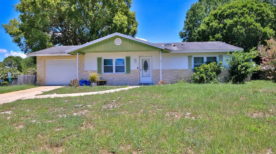 CASH BUYER ALERT! Awesome location & good bones! It's time to finish what the owners started & make this home your own! Both bathrooms are updated. Master bath has striking tile in the walk in shower, vanity with granite counter, updated lighting & toilet. Hall bath offers tub with pretty tile, updated vanity & vessel sink, toilet. Ceramic tile though out. Hurricane impact windows! Updated ceiling fans & light fixtures throughout, gorgeous leaded glass entry door & storm door! Spacious Florida room with vinyl windows, big corner lot, fenced yard, shed with electric for all your stuff! Great location in the heart of Port Orange! ;Water: City