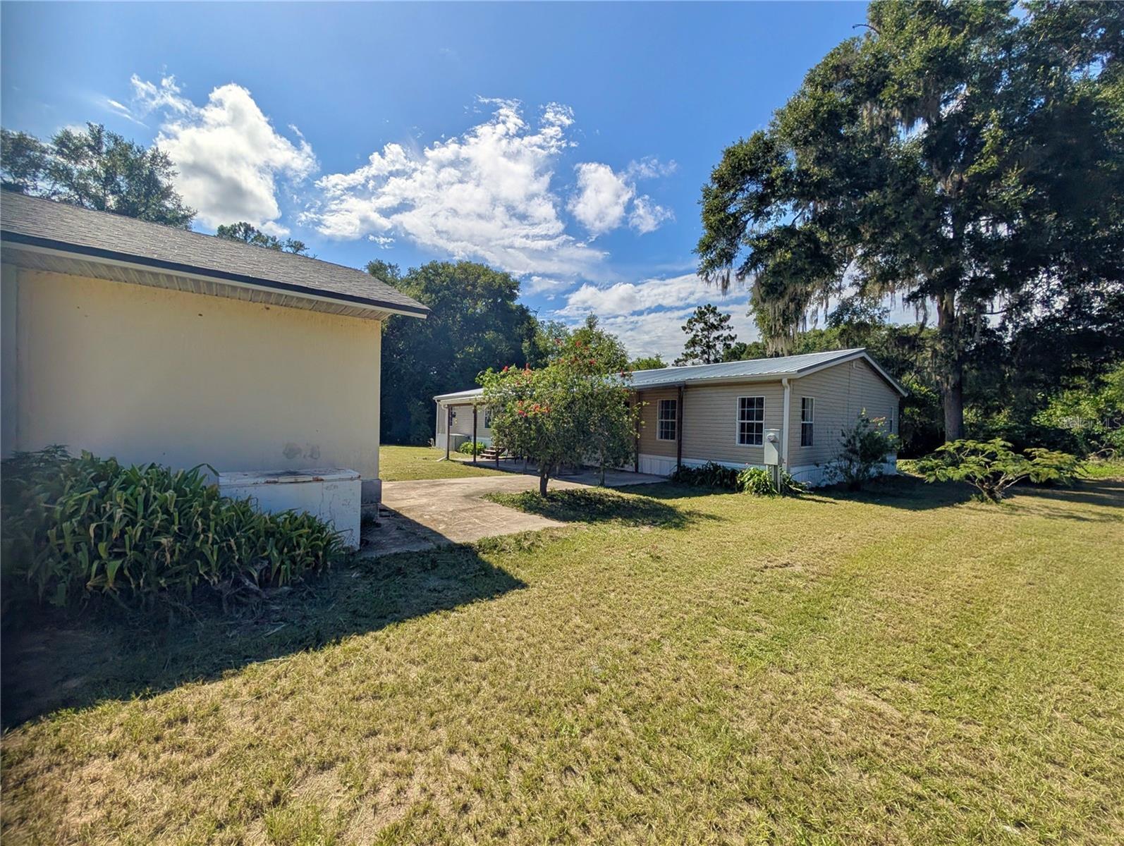 4BD/2.5BA Fenced Home On 1 Acre With A Large 19'x38' Concrete Building! This tastefully renovated home has room for everyone inside and out. The spacious kitchen has a beautiful tile design, breakfast bar and room for all your baking and cooking delicacies! The kitchen, dining room, bathrooms and primary walk-in closet have beautiful waterproof vinyl plank flooring. Outside enjoy the covered porch large enough for entertaining even in the rain. Bring your ideas for the concrete building-a workshop, MIL suite, apartment, office, she-shed...the possibilities are endless! You are just minutes from shopping, restaurants, the hospital and other medical facilities. Only minutes to Salt Springs, Silver Glen, Green Cove Springs, Keystone Heights and Fort McCoy. Less than an hour to Crescent Beach, Historic Saint Augustine, Saint Augustine Beach, Flagler Beach, Palm Coast, Gainesville and Ocala. World Famous Daytona Beach, Orlando theme parks, Jacksonville and Jacksonville Beach are less than 2 hours away.