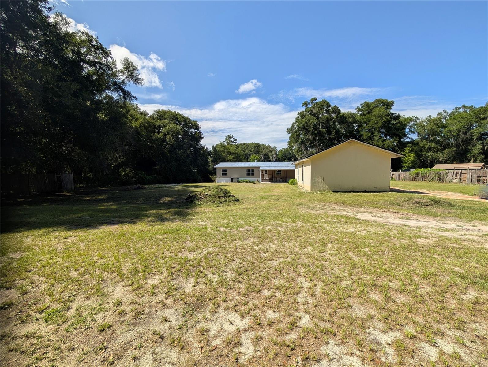 4BD/2.5BA Fenced Home On 1 Acre With A Large 19'x38' Concrete Building And A New Roof! This tastefully renovated home has room for everyone inside and out. The spacious kitchen has a beautiful tile design, breakfast bar and room for all your baking and cooking delicacies! The kitchen, dining room, bathrooms and primary walk-in closet have beautiful waterproof vinyl plank flooring. Outside enjoy the covered porch large enough for entertaining even in the rain. Bring your ideas for the concrete building-a workshop, MIL suite, apartment, office, she-shed...the possibilities are endless! You are just minutes from shopping, restaurants, the hospital and other medical facilities. Only minutes to Salt Springs, Silver Glen, Green Cove Springs, Keystone Heights and Fort McCoy. Less than an hour to Crescent Beach, Historic Saint Augustine, Saint Augustine Beach, Flagler Beach, Palm Coast, Gainesville and Ocala. World Famous Daytona Beach, Orlando theme parks, Jacksonville and Jacksonville Beach are less than 2 hours away.