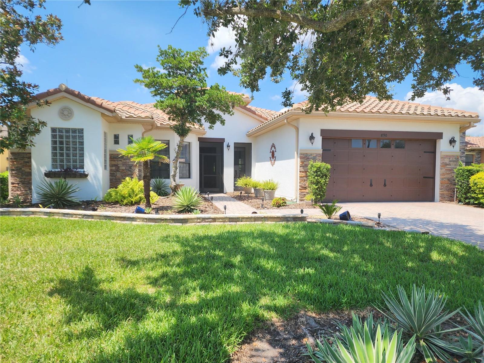 Wow! talk about a stunning unique coconut grove model in the serene Vizcaya subdivision of SOLIVITA a 55+ community. The barrel tile roof with lighting rods adds curb appeal and safety. A beautiful garden wall surrounds the home with updated landscaping and screened in front entrance. The home boasts a 27x35 covered lanai (with rebar corners for a hot tub or outdoor kitchen or both) and fenced in large back yard that could house a pool. Upon entering the home you are welcomed with an open floor plan and 10' ceilings. Cedar accents, 12mm laminate flooring, rounded corners, 8" base molds throughout house and crown molding in main living area. Talk about a chefs delight this kitchen features a 36" professional range with a custom cedar hood, pot filler, built-in refrigerator, 42" with 12" lighted cabinets and specialty cabinets with bottom pullouts, trash pullout and a mixer pullup. The 12' island boast a 43x17" workstation sink, industrial faucet, new garbage disposal, 2 drawer dishwasher, microwave drawer, and beverage center. Quartz counter tops and counter splash with all upgraded stainless-steel appliances. Custom built-ins in family room with lighting underneath, cedar wall with wall lighting. Library has all custom built-ins and lighting. Office Boast a custom-built desk with shelfing and a murphy cabinet bed. New Vanities and mirrors in all the bathrooms. Laundry room/butler’s pantry has built-ins, sink and tile backsplash. New HVAC with allergy lamp in 2021, hybrid hot water heater in 2021, garage epoxy floor, 6 overhead (Save Racks) storage racks, steel charcoal gray garage storage system. House exterior was painted 2023. Roof was cleaned and treated 1 1/2 years ago. Solivita is an award-winning Community with 2 Championship Golf Courses, 14 community pools, 2 state of the art Amenity centers, community garden, indoor walking track, tennis, pickleball, bocce ball/cornhole, softball, dog parks. With 4,000+ acres there are plenty of green spaces and walking trails throughout not to mention the 200+ clubs. There's plenty to keep you busy in Solivita. ** Poinciana Lakes Plaza is a new shopping center across the street from the main gate. Featuring Sprouts Grocery, TJMAXX, Burlington, Ross, Pet store, etc. with a Panda Express, Outback Steakhouse, First watch to mention a few Restaurants. The new expressway gets you to the attritions with ease. The Sun Rail Poinciana Station is near. COME see this amazing home and area.