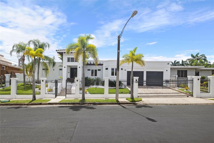 This captivating architectural masterpiece is located at Torrimar Alto. Exclusive gated community located in Guaynabo. The contemporary design home sits in a lot of 1,150 square meters. The impressive outdoor features a stunning covered terrace, pool with jacuzzi, BBQ with gazebo area. Ideal home for entertaining family and friends.This house consists of 3,730 sq ft, with high ceilings and open lay out design. Marble floors throughout, exquisite finishes. Spacious living room, dining room, family room,and a gourmet kitchen with breakfast area. The gourmet kitchen, include top of the line appliances, two refrigerator,electric stove with hood, dishwasher, conventional and microwave ovens. Laundry area and a garage for two cars.This home offers a nice gym with an ensuite bathroom, also to be used as an office, playroom or guest room. Six bedrooms, and four bathrooms and one half bathroom. A luxury master suite with a private "en suite" bathroom and a spectacular walking closet. Two junior suites with ensuite bathroom and a walking closet. This home includes a 40 k diesel Generator, two 600-gallon water cisterns, intelligent home, security system, patio light system, pool water heater, 7 a/c units, washer and dryer, security door and windows, garage door, irrigation system Luxurious amenities exclusively for Torrimar residents enjoyment:24/7 security, activity center and playground. Conveniently located, close to private schools: fine dining restaurants,shopping centers and other places of interest. Don't miss this opportunity. For a private showing call us today.