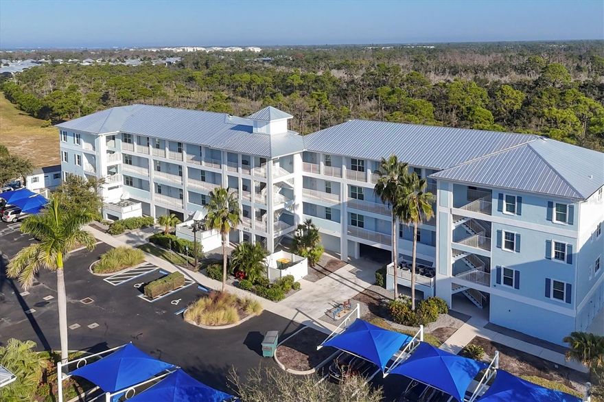 Welcome to your slice of paradise in this resort-style condo FULLY FURNISHED located on the 4th floor, offering a serene view of the lush preserve from your screened-in porch. Step into luxury living with a new elevator system granting easy access and a coveted tandem 2 CAR GARAGE equipped with a humidifier and ample storage space beneath the building. Recently adorned with fresh coastal-inspired paint, this 2-bedroom, 2-bathroom haven boasts upgraded impact windows and doors for hurricane protection, ensuring peace of mind during storm seasons. Revel in modern comforts with a new A/C, water heater, and metal roof enhancing durability and efficiency. The heart of the home is a chef's dream, featuring a stylish eat-in kitchen adorned with granite countertops, wood cabinets, and a convenient breakfast bar. Whether preparing meals or entertaining guests, the kitchen seamlessly flows into the spacious living and dining area, all offering breathtaking views of the natural surroundings from the screened porch. Retreat to the primary bedroom oasis complete with a walk-in closet and an ensuite bath featuring granite countertops, and newly tiled shower. The generously sized guest room is situated adjacent to the guest bath, ensuring comfort and privacy for family or visitors. Indulge in the unparalleled amenities of the resort-style community, including a heated pool, spa, clubhouse, fitness center, putting green, and courts for pickleball, tennis, and basketball. Explore nearby attractions such as Boca Grande, Don Pedro Island, and Englewood Beach, while marinas, shopping, dining, golfing, boating, fishing, and entertainment are all within easy reach. Embrace an active lifestyle with daily walks along the community sidewalks, knowing you've found the perfect blend of luxury, convenience, and leisure in this coastal gem.