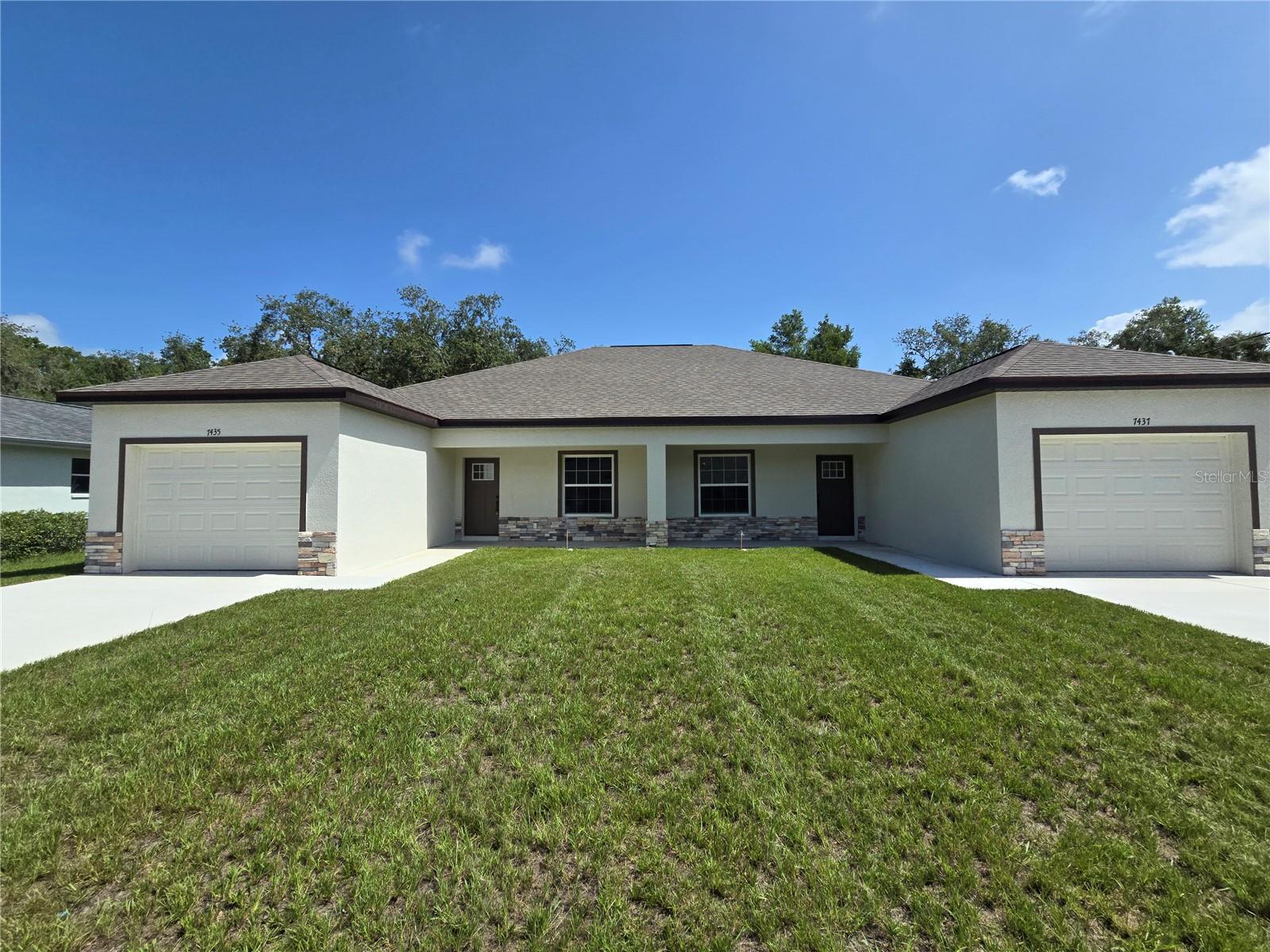Built in 2025, this duplex is just what you have been looking for. Located in the heart of Spring Hill and close to shopping, dining and the expressway, this brand new home has it all. Upon entering you walk into an open floor plan with a living room, dining area and kitchen. The elegantly designed kitchen features soft close cabinets, stainless steel appliances and a pantry. The dining area has sliders leading to the covered lanai. The split floor plan offers privacy yet a sense of closeness. Do not miss this great home!