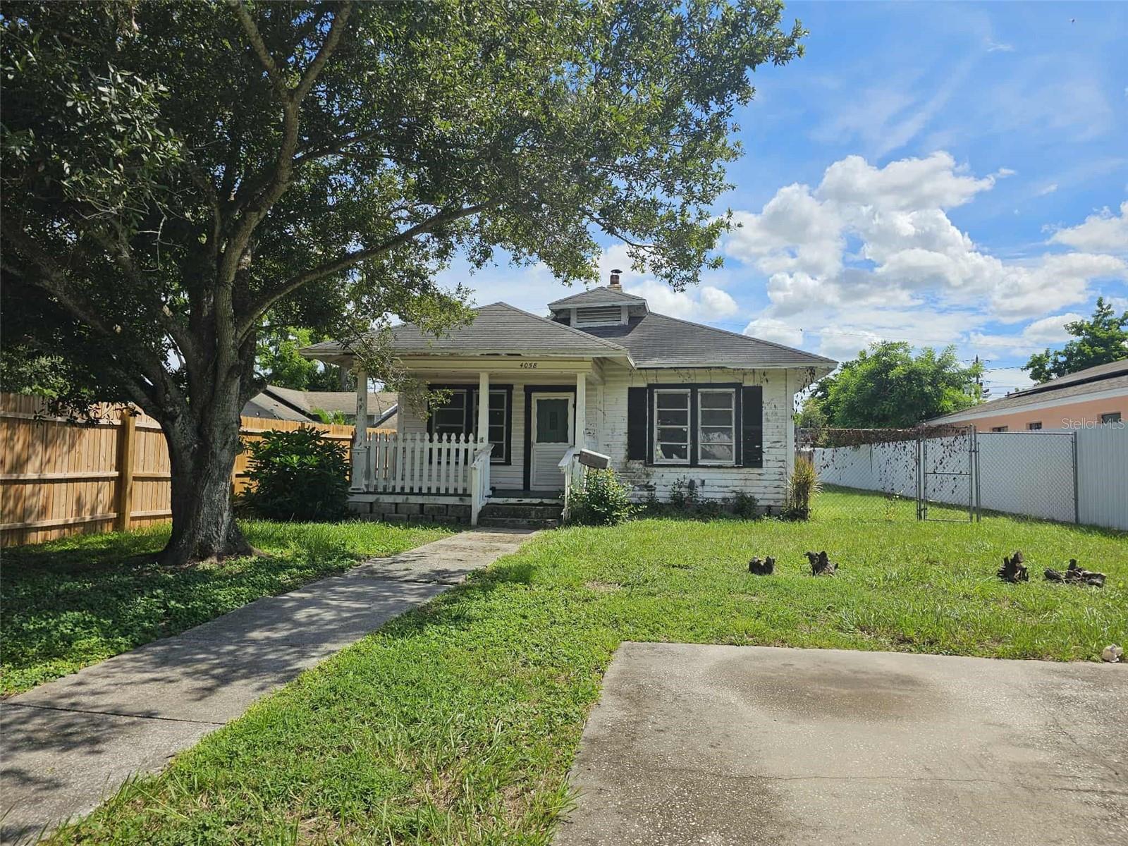 This charming 2-bedroom, 1-bath home, built 100 years ago, is brimming with potential. Located in a non-evacuation area with both street and alley access, this fixer-upper is perfect for those looking to restore a piece of history while adding value. Key Features: 2 Bedrooms, 1 Bath – Great layout with classic charm. 9-Foot Ceilings – Spacious and airy, offering a sense of openness. Fireplace – A cozy centerpiece, ideal for those chilly nights. Fenced Yard – Plenty of space for outdoor activities or future improvements (Potentially a legal ADU) 1-Car Garage – Convenient off-street parking. Dual Access – Both street and alley access for added convenience. This home is a fantastic opportunity for cash buyers looking to invest in a project with great potential. With a little vision and some elbow grease, this home can be transformed into a stunning gem.