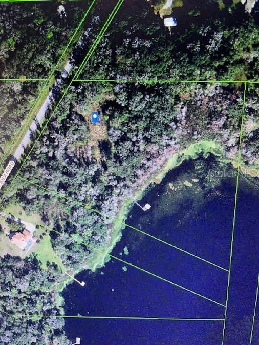 Build and customize your beautiful home in this one of a kind 10.76 acres waterfront lake lot and imagine all of the possibilities this property offers. A rare opportunity to own and enjoy the Florida lifestyle, fishing, kayaking, and canoeing. Create a beautiful garden, grow fruit trees and immerse the privacy and tranquility of this quiet community. 
Come and envision your investment or new home that is a perfect city getaway, conveniently located just 4 minutes to I-75 and 40 minutes to Tampa. This is a must see to invest, build now or build later. This property can be split into 2 parcels. 
Aerial photo property lines are an estimate and to be verified by buyer. And buyer to verify acreage, land use, and zoning classification to determine the best and use of land. This is a pristine land that has never been built on and would require buyer to put in well, septic and pay impact fee.