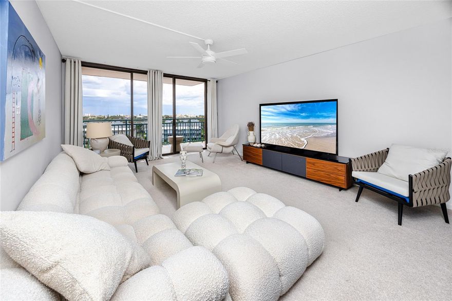 Step into this beautifully updated, fully furnished sixth-floor residence in the highly desirable Key Capri community—an exclusive waterfront condo enclave located on its own private island directly across from the famous John's Pass Boardwalk and inlet. This move-in ready, two-bedroom, two-bathroom retreat offers views of Boca Ciega Bay and is ideal for buyers seeking turnkey waterfront living with style, comfort, and peace of mind. Natural light pours through large windows, illuminating the spacious open-concept floor plan. The expansive private balcony, accessible from both the living room and the primary suite, is the perfect place to relax and take in the panoramic water views. Inside, you'll find brand-new contemporary furnishings and décor, including high-end Avocado mattresses—organic, eco-friendly, and supremely comfortable. A brand-new large flat-screen TV, stylish new fans and fixtures, and beachy glass subway tile backsplashes in the kitchen complete the polished look. The updated kitchen features sleek quartz countertops, premium stainless steel appliances including a new refrigerator, dishwasher, and kitchen accessories. A full-size GE smart stacked washer and dryer are conveniently tucked into the kitchen’s laundry closet. The primary bedroom offers private balcony access, a smart built-in organization system in the walk-in closet, and an elegant en suite bathroom with split vanities and a walk-in, fully tiled shower. Additional upgrades include a new water heater (2021), a newly replaced roof on the building, and fully renovated public areas. This home also includes a covered parking space and an adjacent private storage unit. Key Capri’s resort-style amenities make every day feel like a vacation. Enjoy the 60,000-gallon geothermal-heated pool, tiki hut with TV, men’s and women’s saunas, tennis and pickleball courts, a putting green, shuffleboard, and a 1/4-mile walking path around the property. The clubhouse offers a billiards room, party room with a full kitchen and 60” TV, fitness center, craft room, and library. The 36-slip marina includes a dedicated kayak and paddleboard launch, with under-building storage available on a first-come basis. Whether you're boating from the marina, lounging poolside, or enjoying nearby beaches, shopping, and dining, this meticulously updated and fully furnished waterfront condo delivers low-maintenance luxury and the best of coastal Florida living. Don’t miss your chance to call Key Capri home!