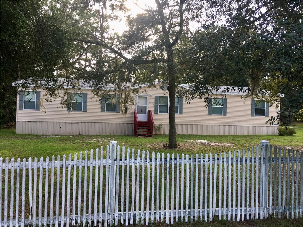 Photo of 5990 NE 101st Ave, Bronson, FL 32621 (MLS # GC543077)