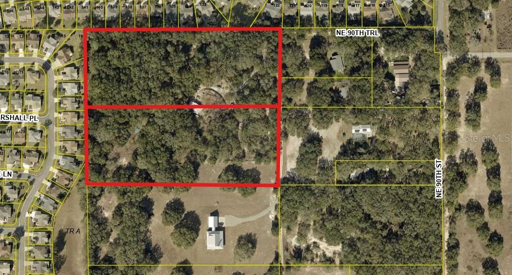 Photo of 8801 NE 90th Trail, Fruitland Park, FL 34731 (MLS # O6419652)