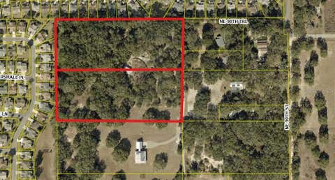 Photo of 8801 NE 90th Trail, Fruitland Park, FL 34731 (MLS # O6419652)