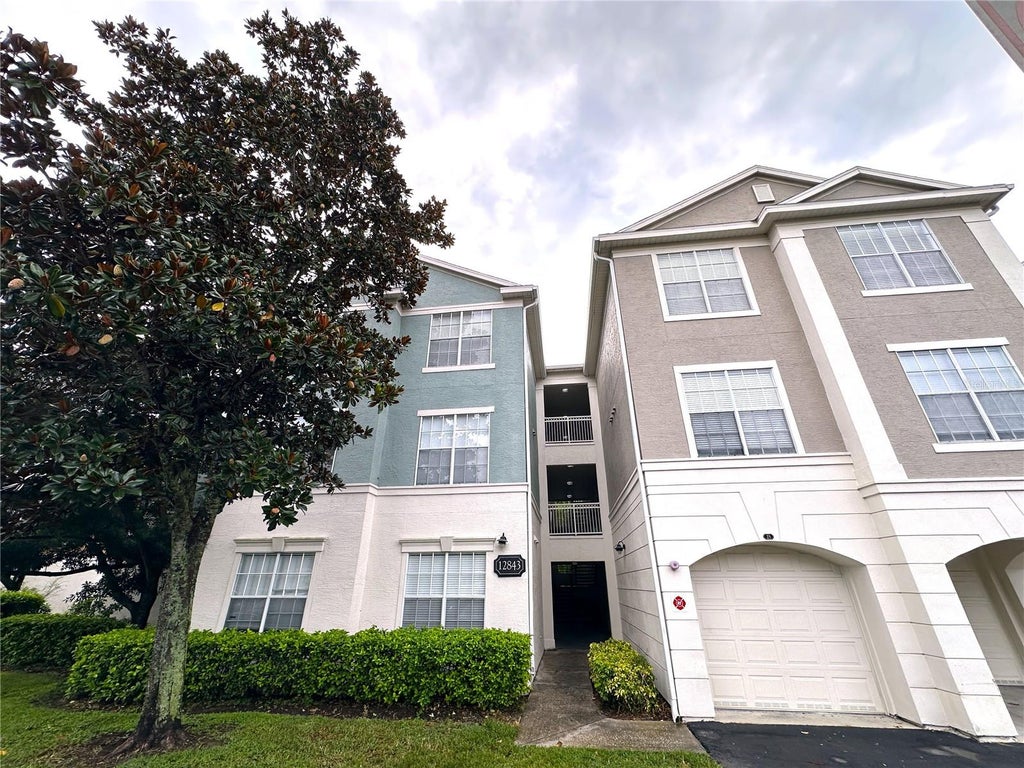Photo of 12843 Madison Pointe Circle #201, Orlando, FL 32821 (MLS # O6429642)